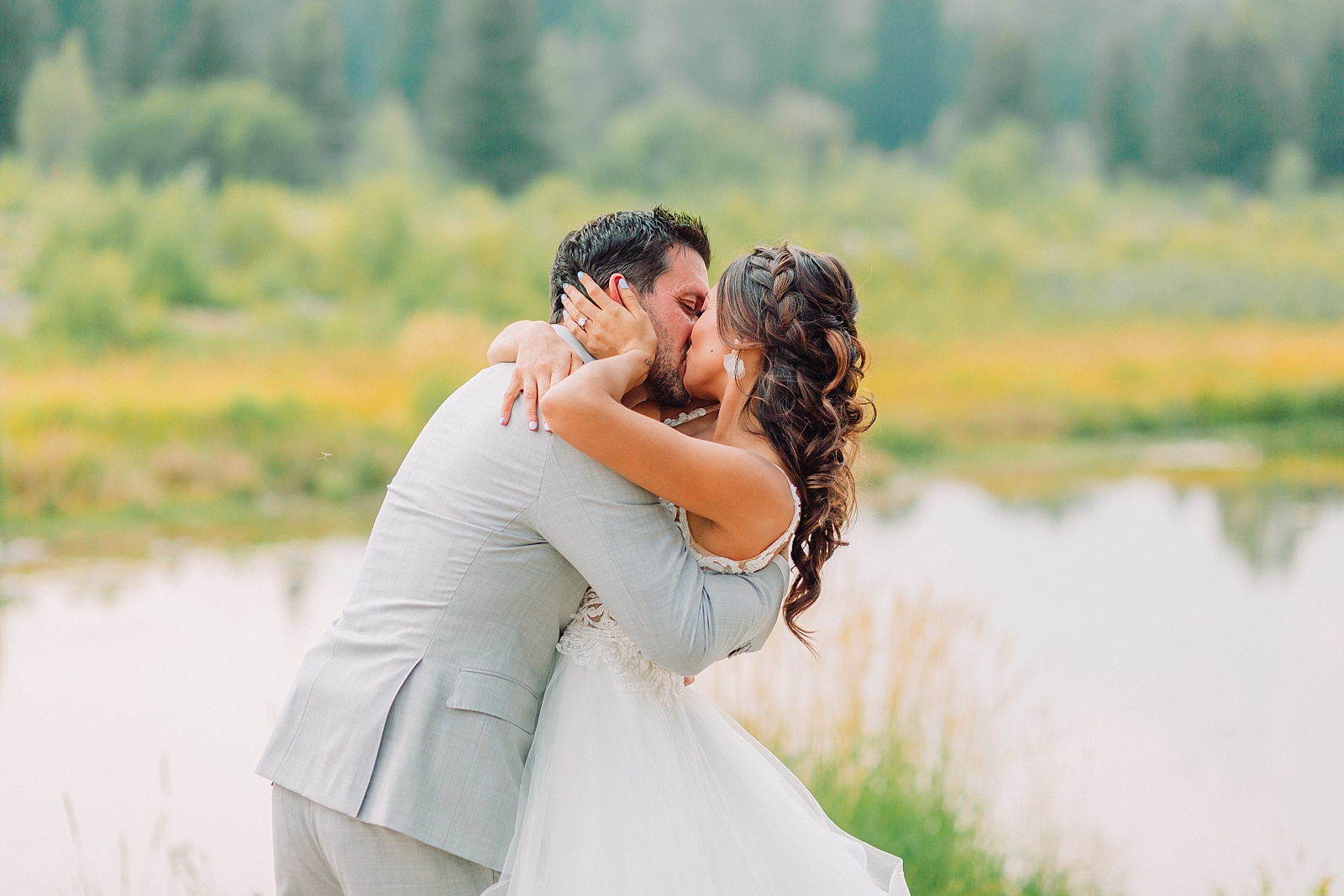 bride and groom kissing at grand teton national park