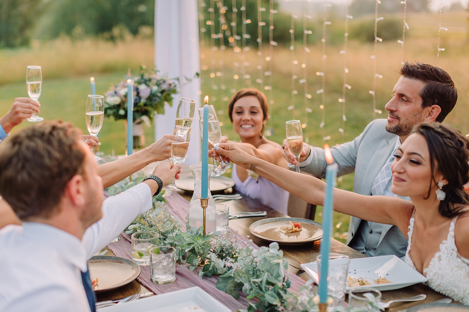 bride and groom celebrating with friends and family after skipping worst wedding traditions