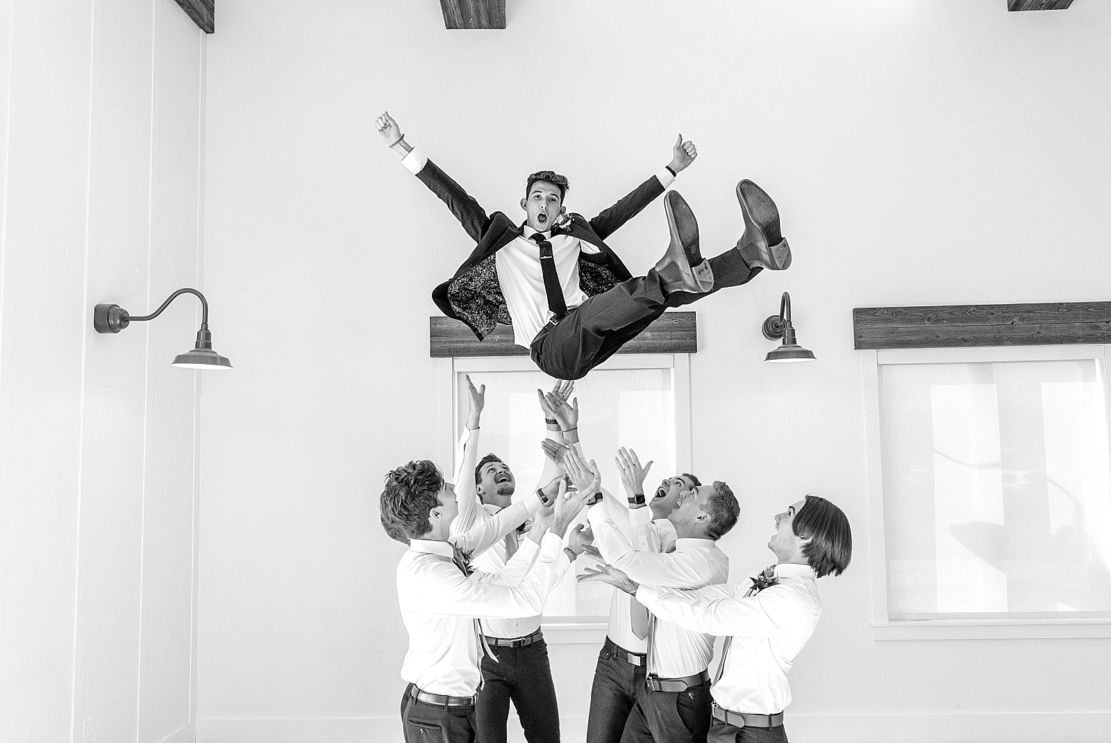 family and wedding party photos in Utah wedding venue photography, groomsmen toss