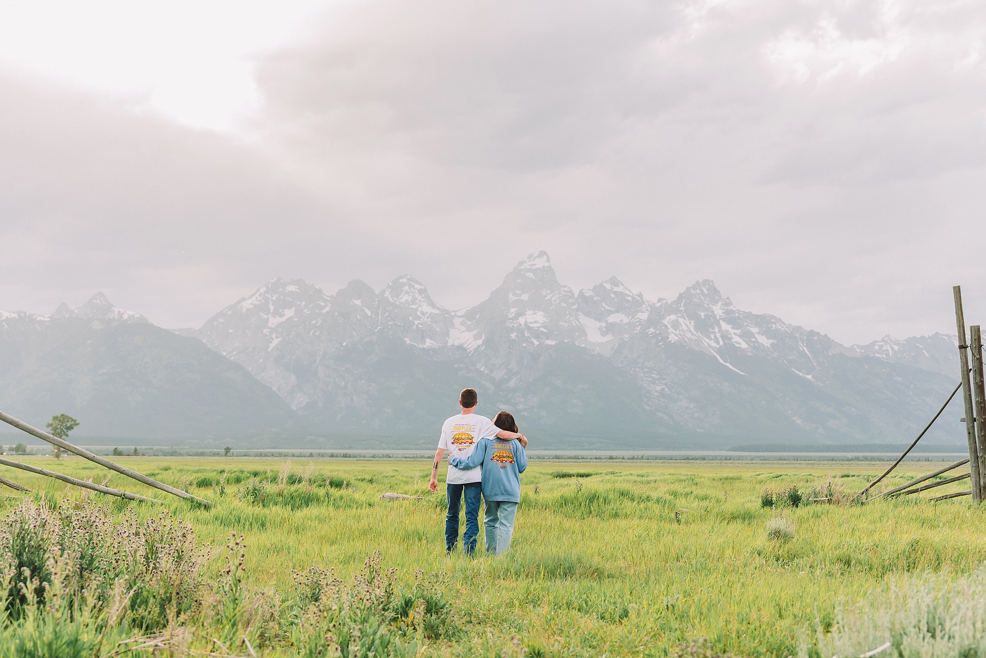 Jackson Hole Engagement Photographer at Mormon Row North Couple poses ideas for natural and candid engagement photos outdoors Jackson Hole engagement photos at Schwabacher Landing Mormon Row North engagement session with Jackson Hole engagement photographer Couple poses ideas for relaxed mountain engagement sessions