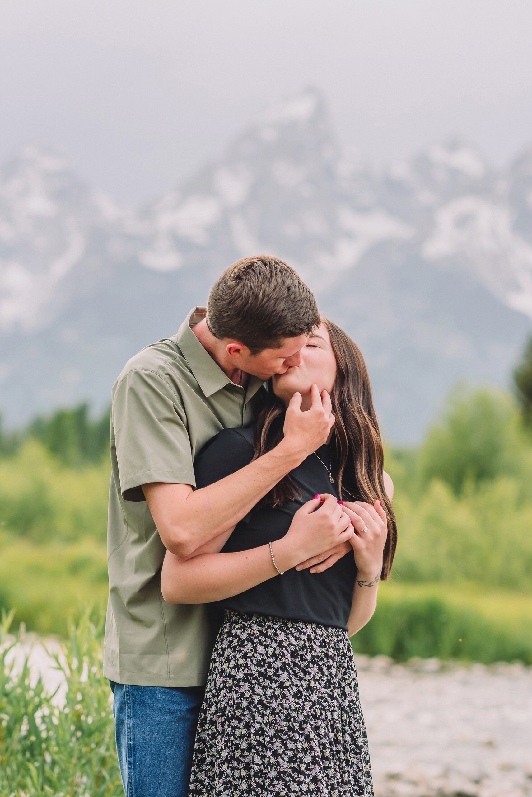 Jackson Hole Engagement Photographer at Mormon Row North Jackson Hole Engagement Photographer for summer sessions in Grand Teton National Park Couple poses ideas for playful engagement photos in Jackson Hole Jackson Hole engagement photos at Schwabacher Landing Schwabacher Landing summer engagement photos Jackson Hole