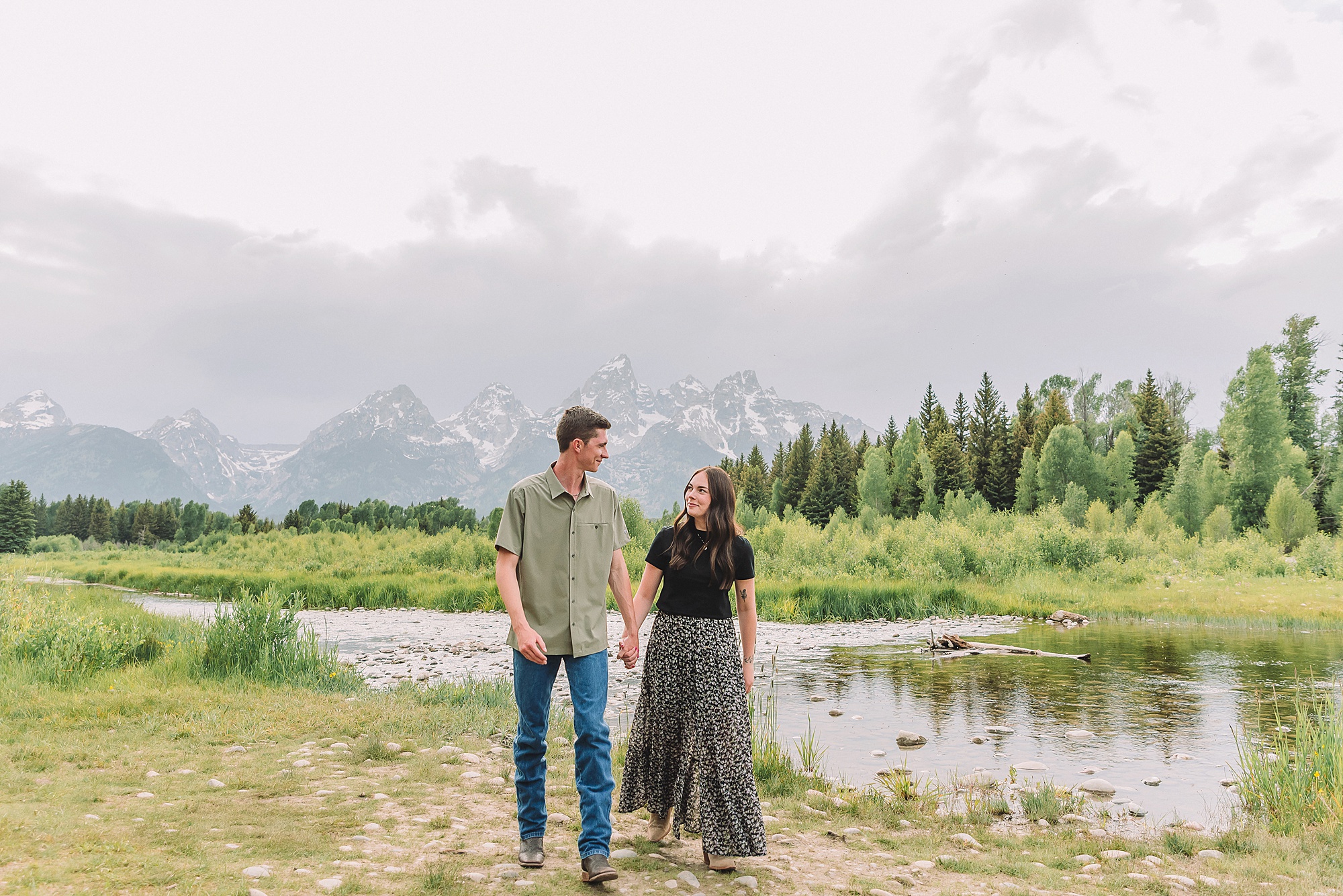 Jackson Hole Engagement Photographer at Mormon Row North Jackson Hole Engagement Photographer for summer sessions in Grand Teton National Park Couple poses ideas for playful engagement photos in Jackson Hole Jackson Hole engagement photos at Schwabacher Landing Schwabacher Landing summer engagement photos Jackson Hole