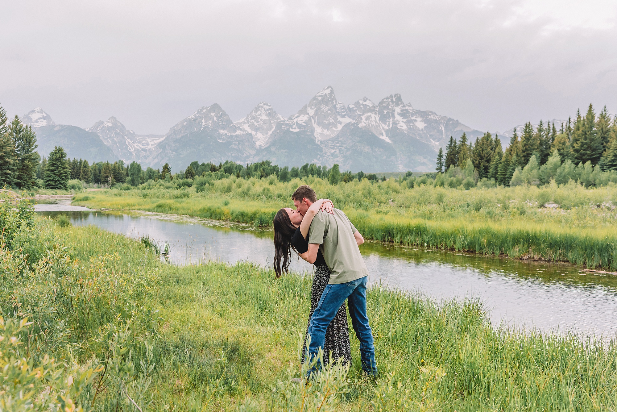 Jackson Hole Engagement Photographer at Mormon Row North Jackson Hole Engagement Photographer for summer sessions in Grand Teton National Park Couple poses ideas for playful engagement photos in Jackson Hole Jackson Hole engagement photos at Schwabacher Landing Schwabacher Landing summer engagement photos Jackson Hole
