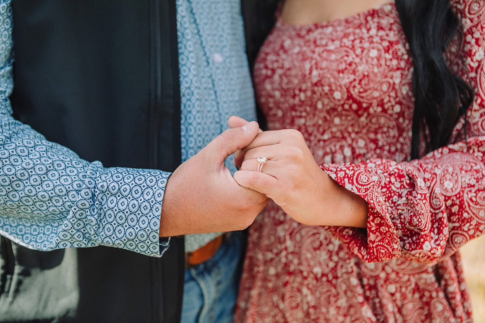 man proposes to girlfriend in fall mormon row proposal with golden grasses and the Teton Mountains