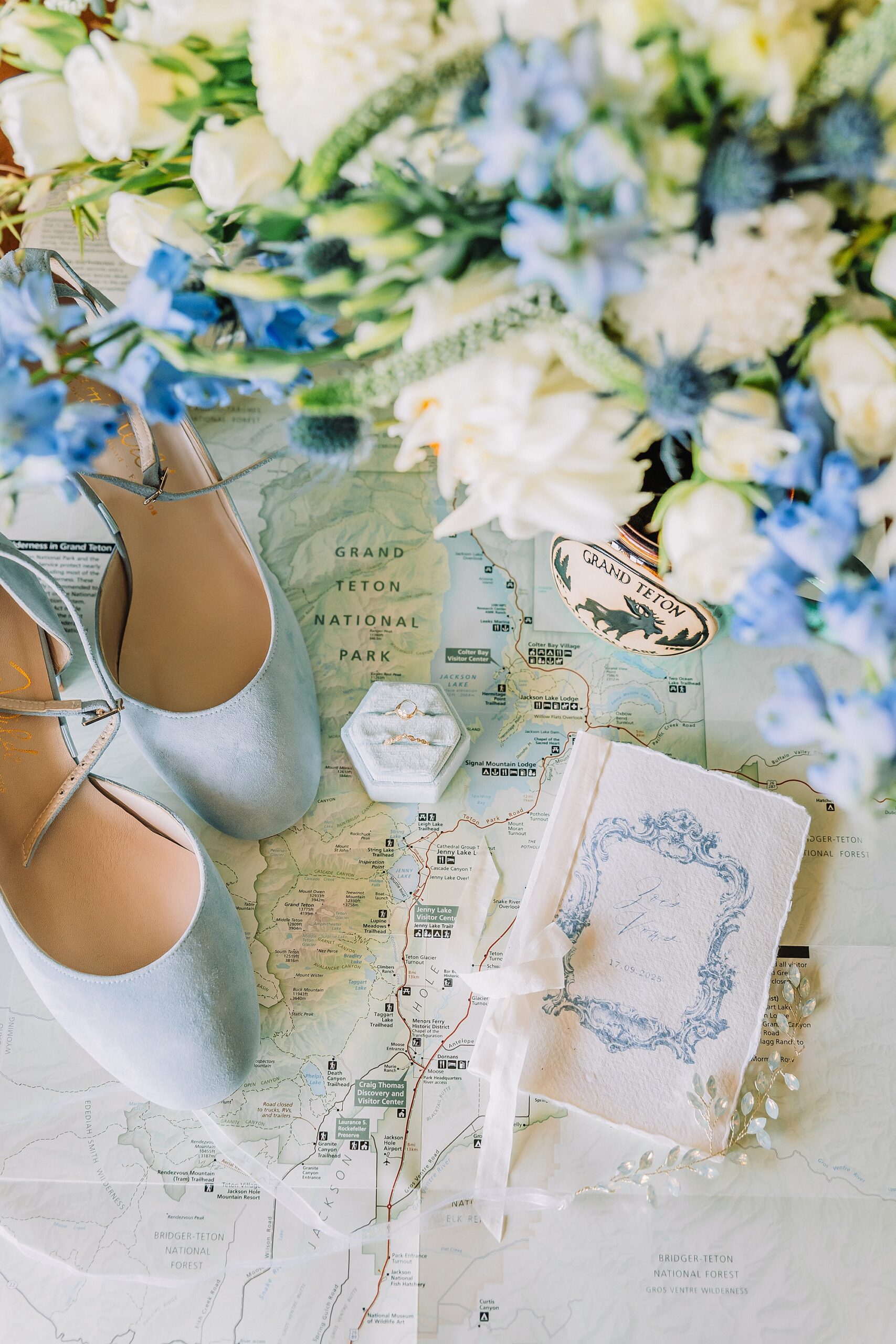 Flat lay of wedding details and vow book