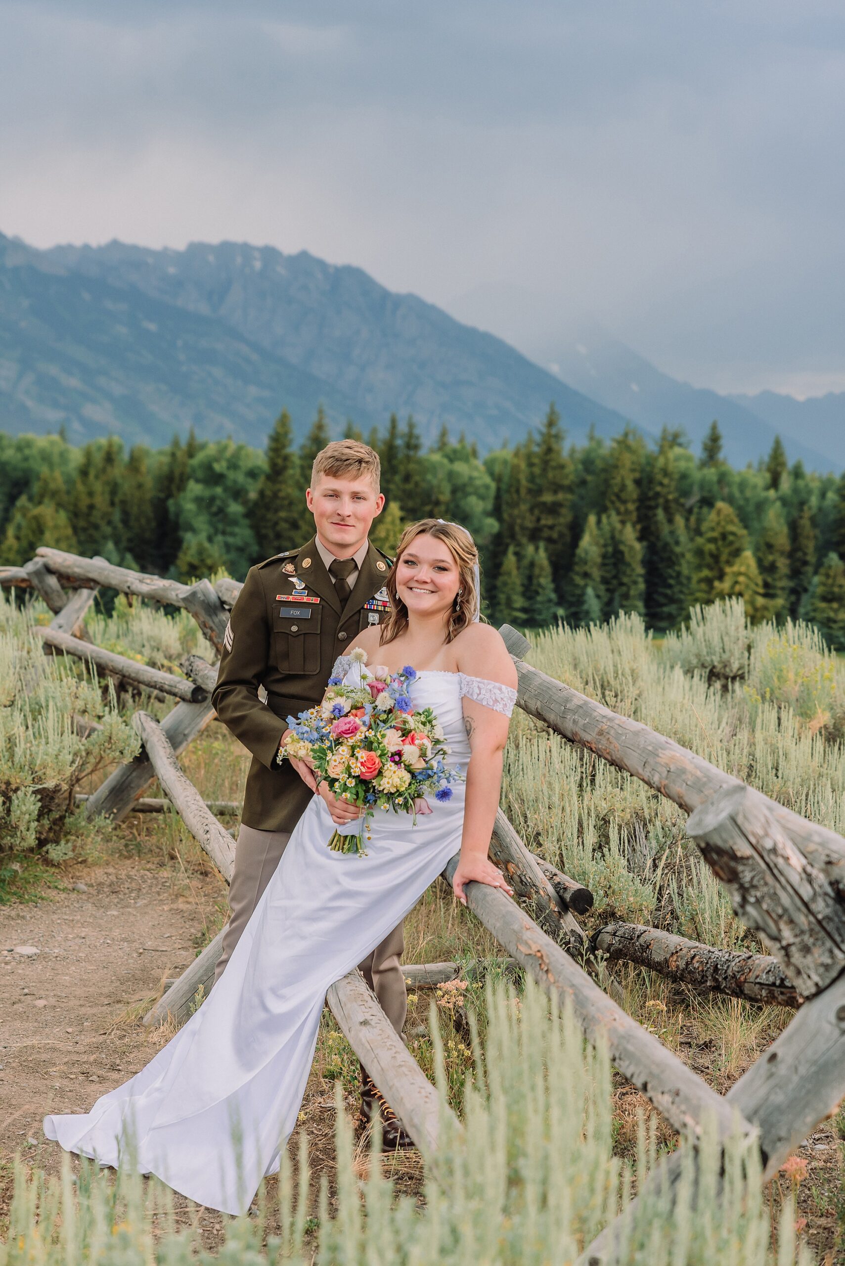 wedding couple poses eloping in jackson hole wyoming small wedding jackson hole summer wedding in grand teton national park snake river overlook wedding ceremony jackson hole wedding photographers blacktail ponds overlook