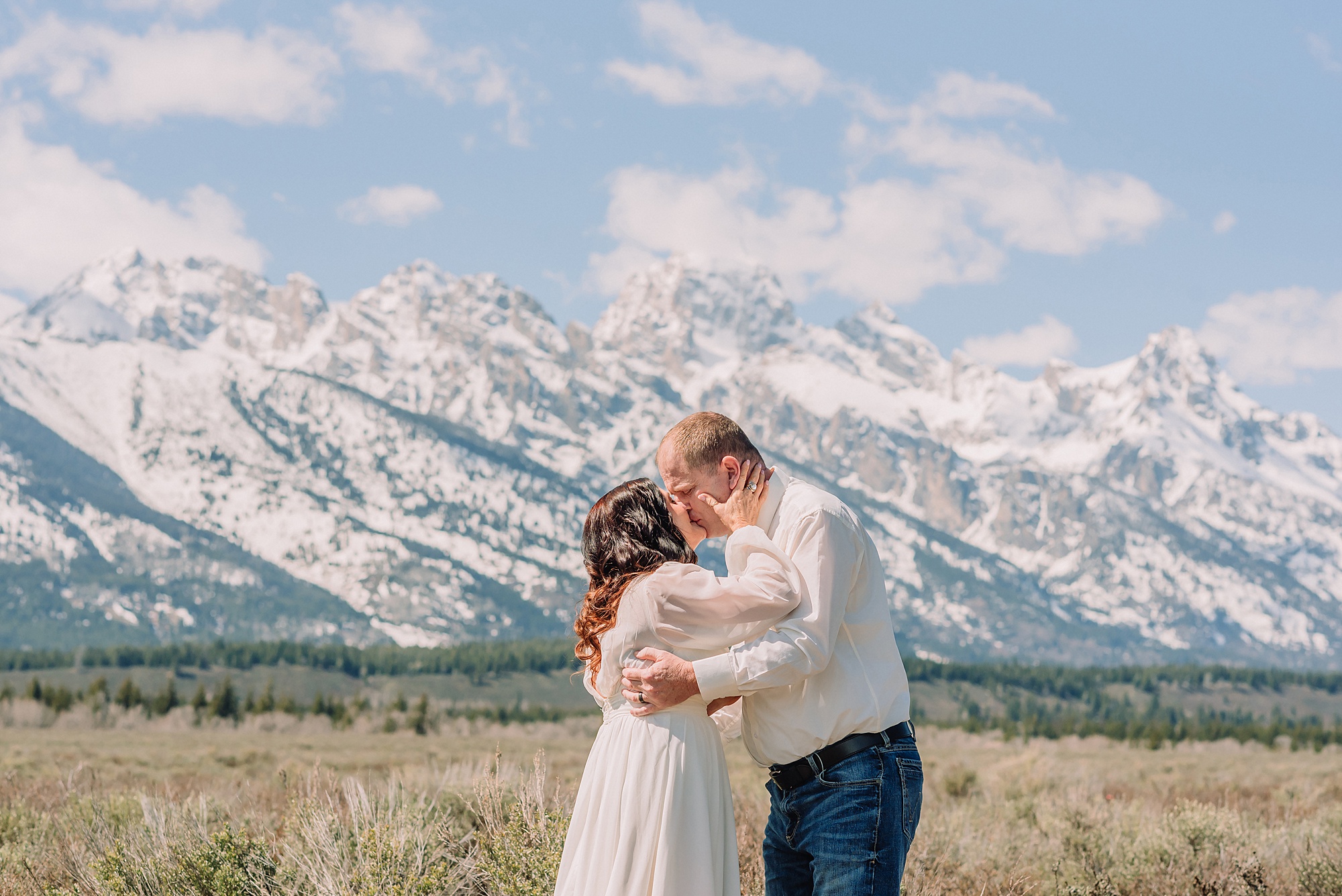 Grand Teton elopement at Albright View Turnout Pastor Ray officiant Grand Teton wedding ceremony Early May Grand Teton elopement photography Intimate mountain wedding with family witnesses