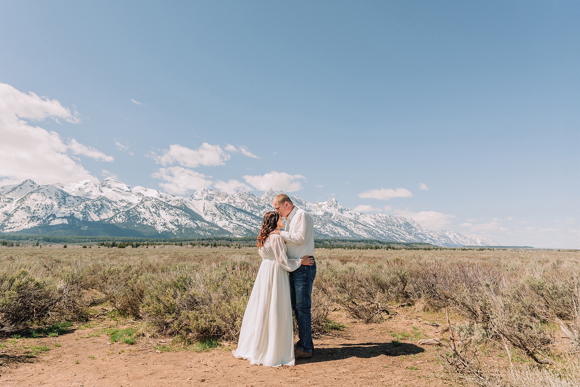 Grand Teton elopement at Albright View Turnout Pastor Ray officiant Grand Teton wedding ceremony Early May Grand Teton elopement photography Intimate mountain wedding with family witnesses