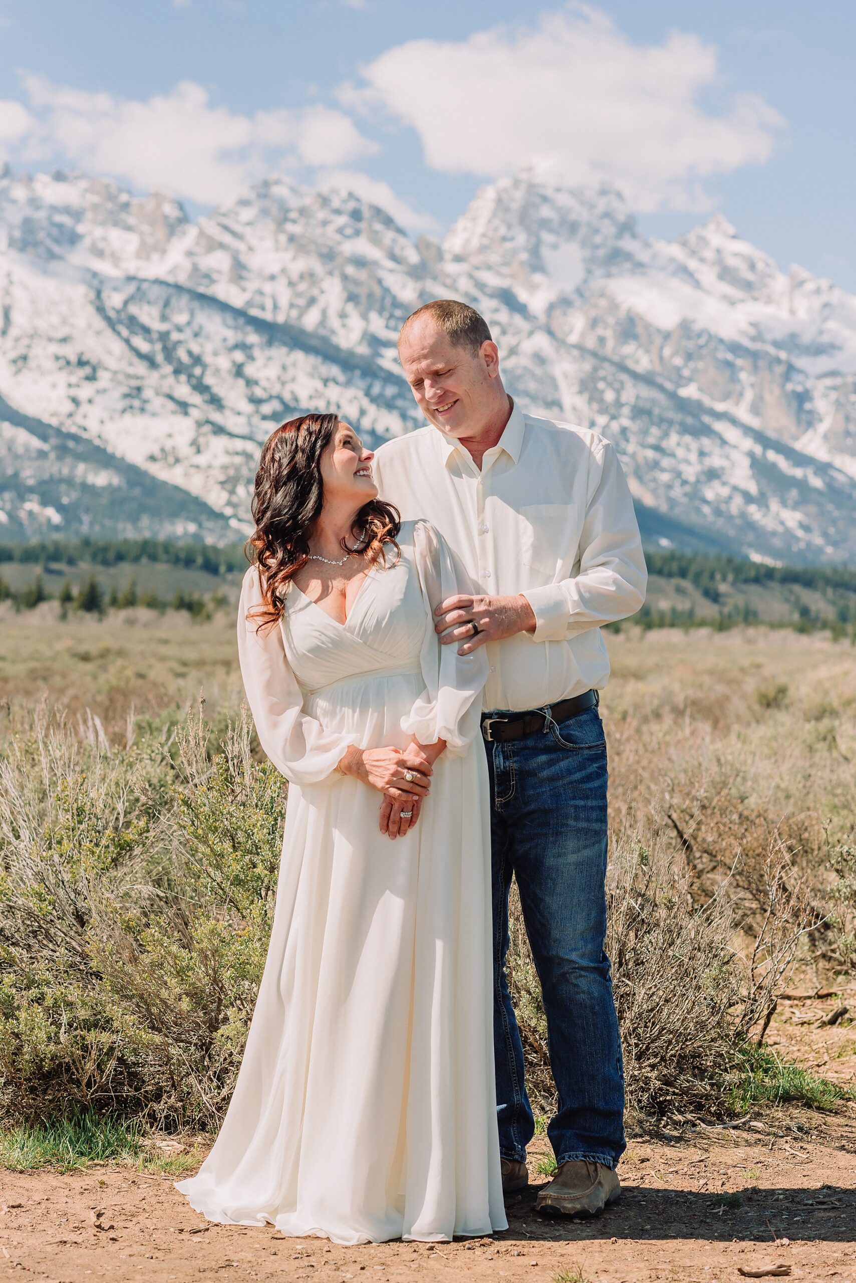 Grand Teton elopement at Albright View Turnout Pastor Ray officiant Grand Teton wedding ceremony Early May Grand Teton elopement photography Intimate mountain wedding with family witnesses