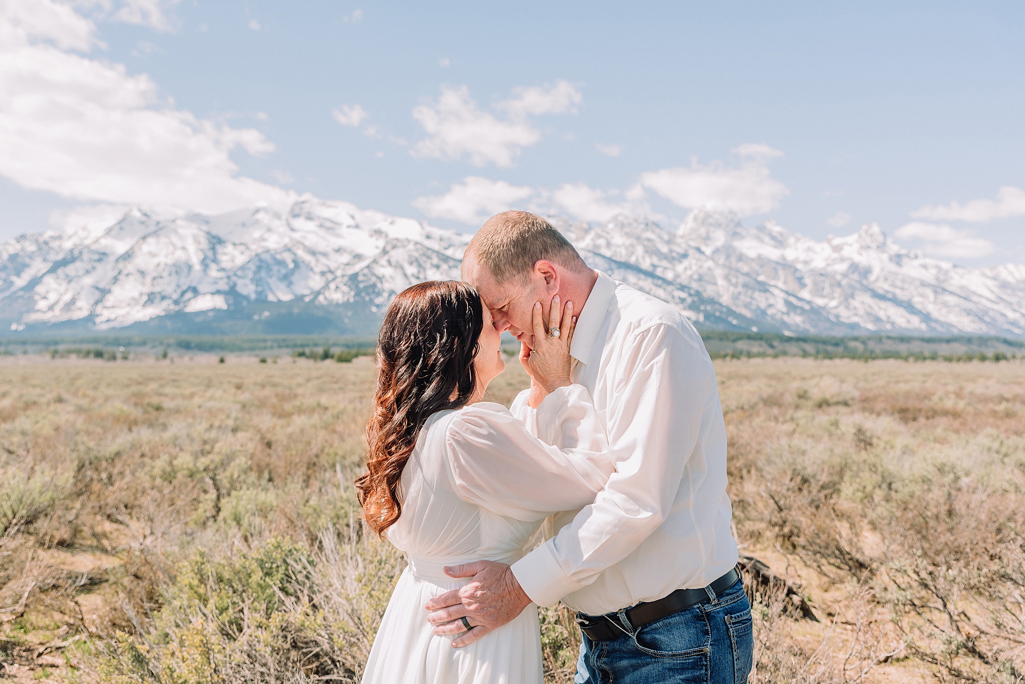 Grand Teton elopement at Albright View Turnout Pastor Ray officiant Grand Teton wedding ceremony Early May Grand Teton elopement photography Intimate mountain wedding with family witnesses