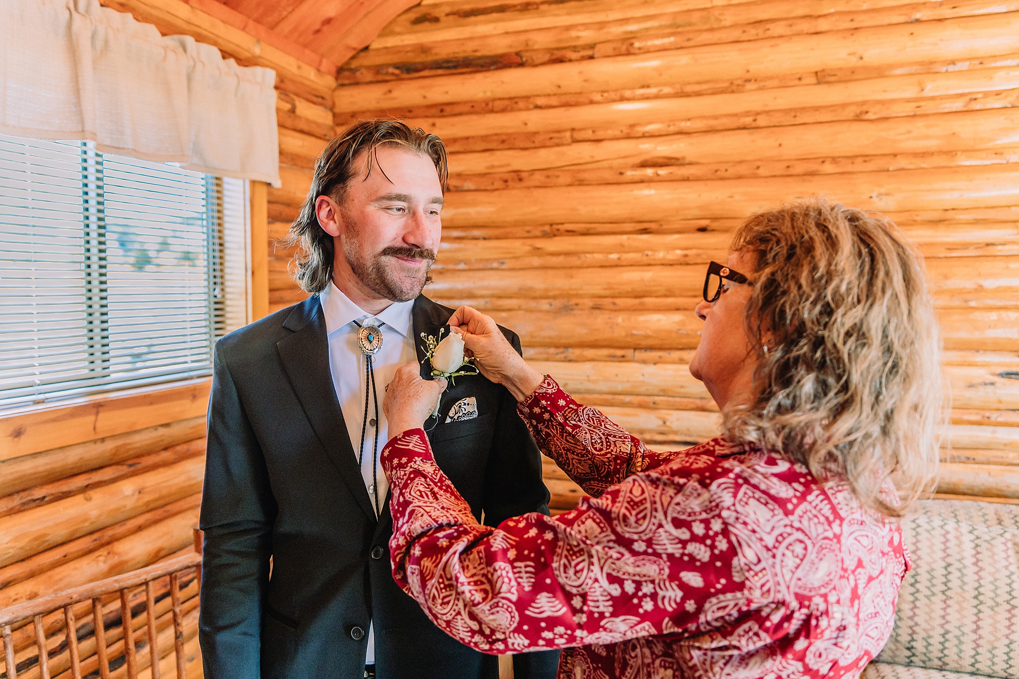 historic chapel wedding Wyoming mountains intimate wedding Chapel of the Transfiguration family photos Chapel of the Transfiguration wedding ceremony Grand Teton bride in mother's wedding dress teal boots fall wedding Chapel of the Transfiguration September Grand Teton National Park micro wedding