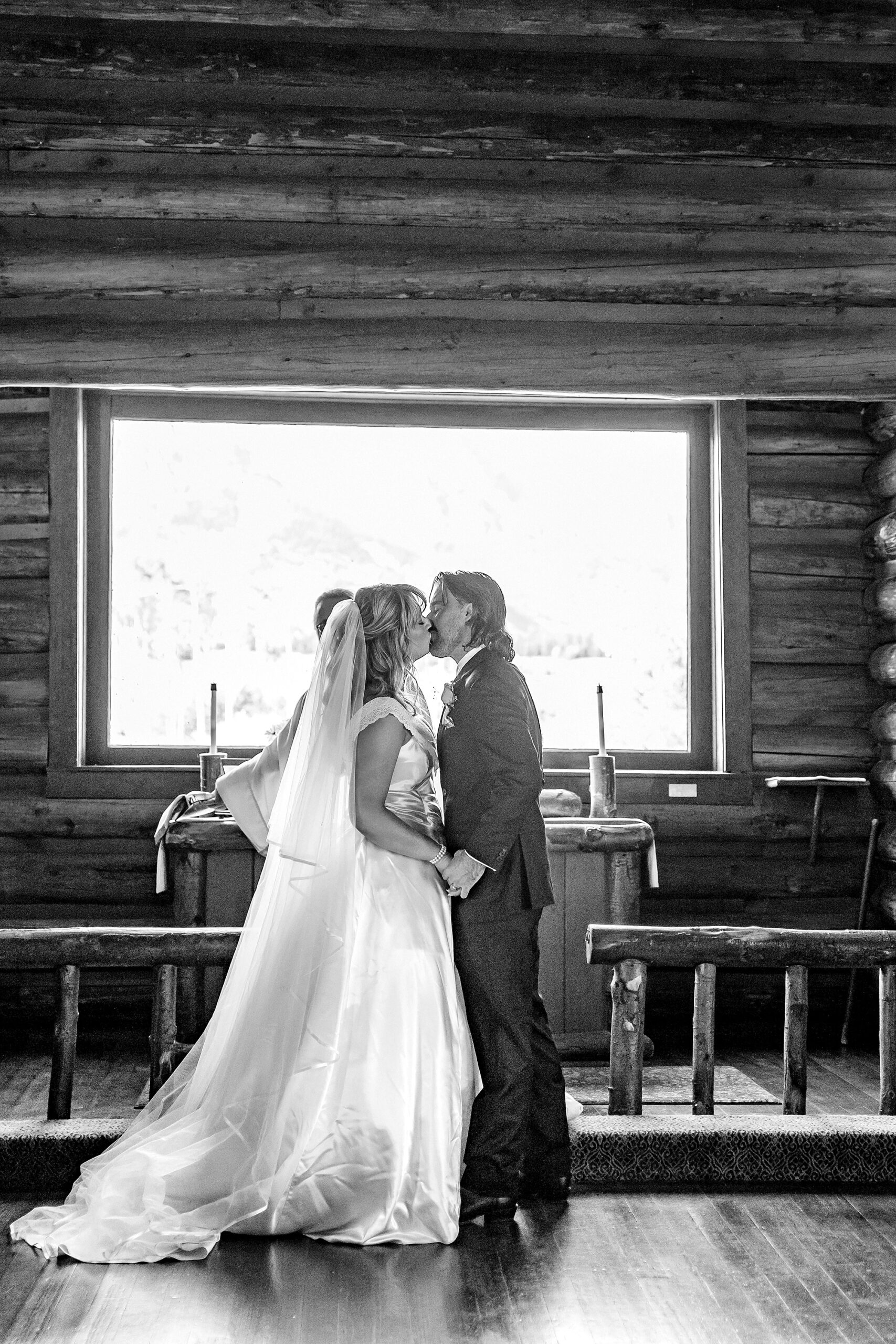 historic chapel wedding Wyoming mountains intimate wedding Chapel of the Transfiguration family photos Chapel of the Transfiguration wedding ceremony Grand Teton bride in mother's wedding dress teal boots fall wedding Chapel of the Transfiguration September Grand Teton National Park micro wedding Chapel of the Transfiguration bride and groom portraits