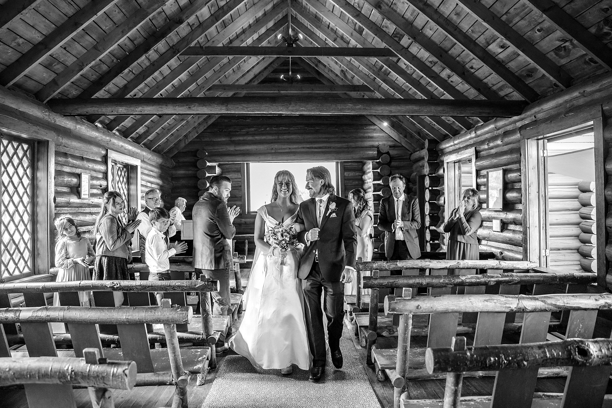 historic chapel wedding Wyoming mountains intimate wedding Chapel of the Transfiguration family photos Chapel of the Transfiguration wedding ceremony Grand Teton bride in mother's wedding dress teal boots fall wedding Chapel of the Transfiguration September Grand Teton National Park micro wedding Chapel of the Transfiguration bride and groom portraits