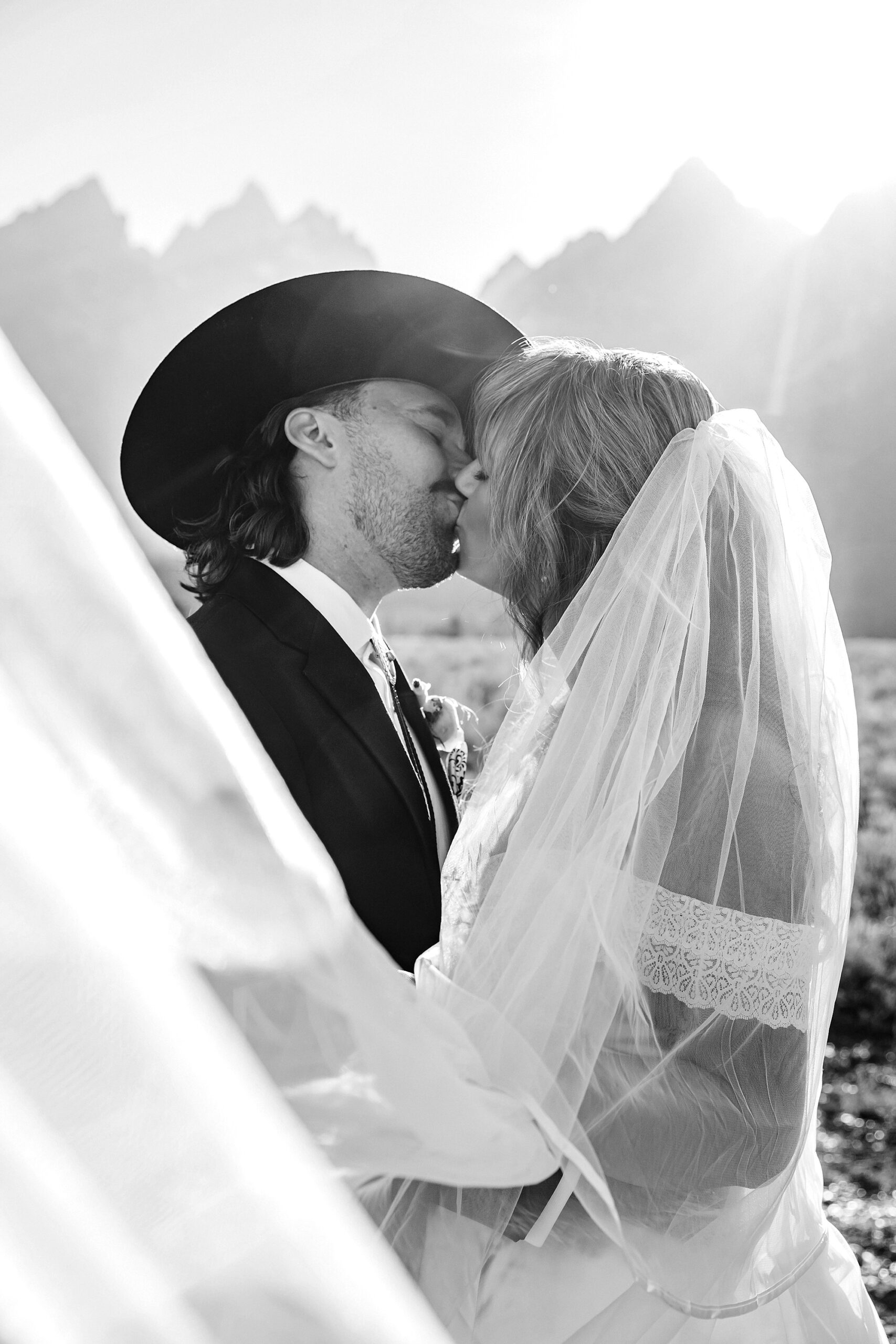 bride in mother's wedding dress teal boots bride groom cowboy hat bolo tie mountain wedding Cathedral Group Turnout wedding photos sagebrush String Lake wedding photography sunset late September wedding Grand Teton fall foliage