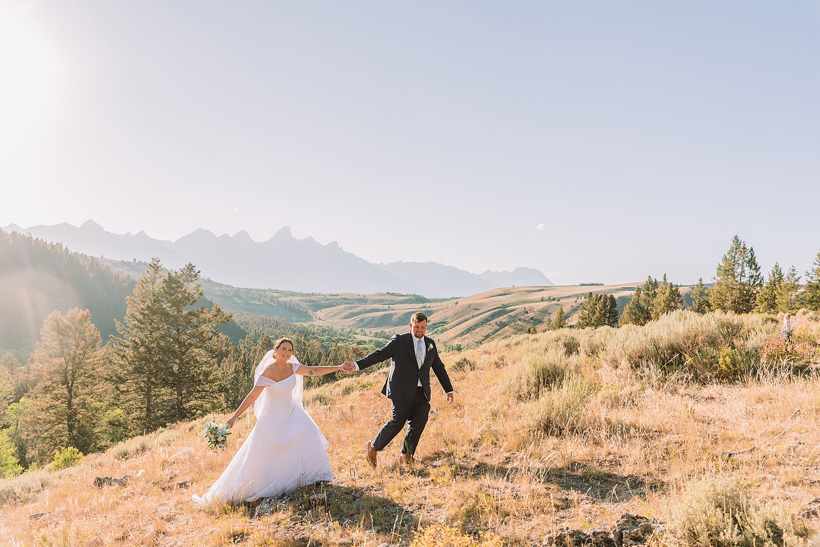 The Wedding Tree ceremony photos Wyoming bride wearing mother's wedding dress mountain elopement with Teton backdrop small intimate wedding ceremony ideas intimate outdoor Wyoming wedding inspiration