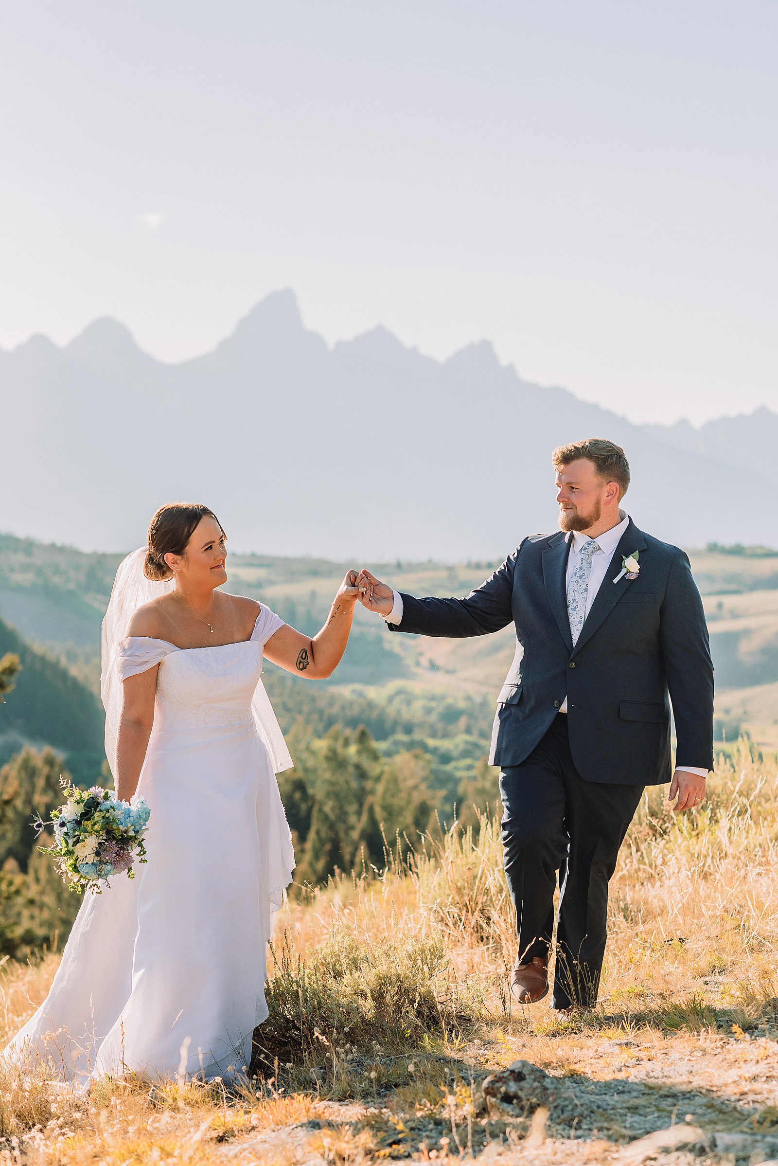 The Wedding Tree ceremony photos Wyoming bride wearing mother's wedding dress mountain elopement with Teton backdrop small intimate wedding ceremony ideas intimate outdoor Wyoming wedding inspiration