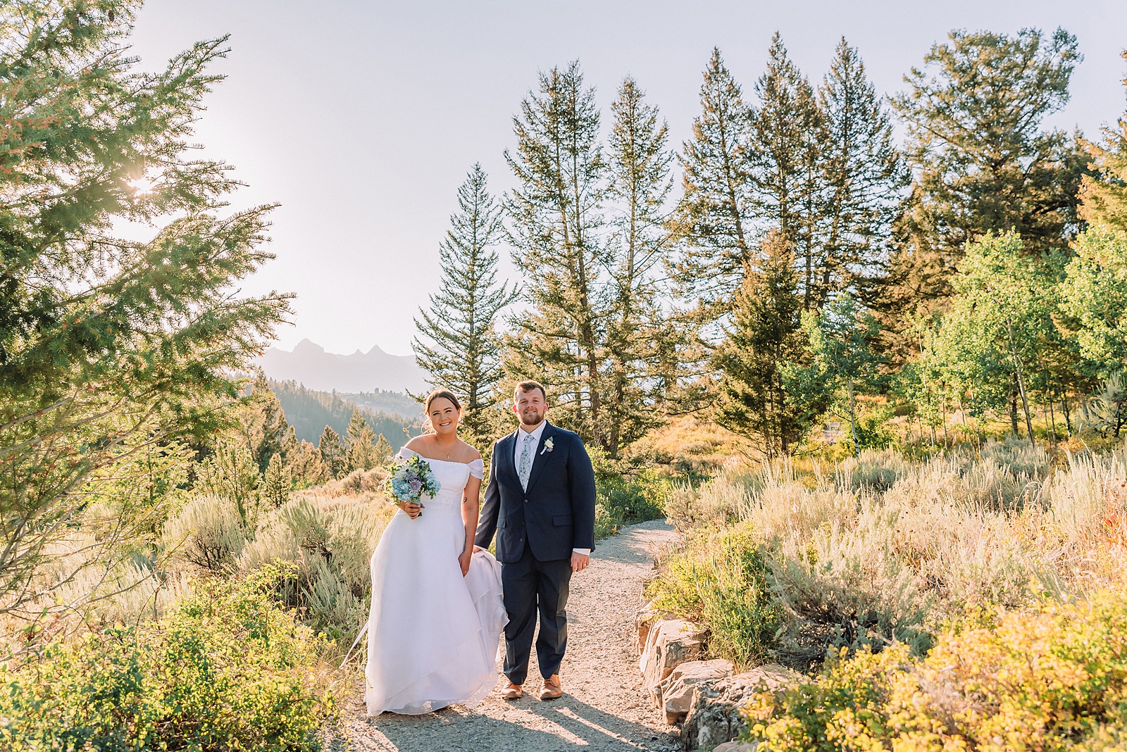 The Wedding Tree ceremony photos Wyoming bride wearing mother's wedding dress mountain elopement with Teton backdrop small intimate wedding ceremony ideas intimate outdoor Wyoming wedding inspiration