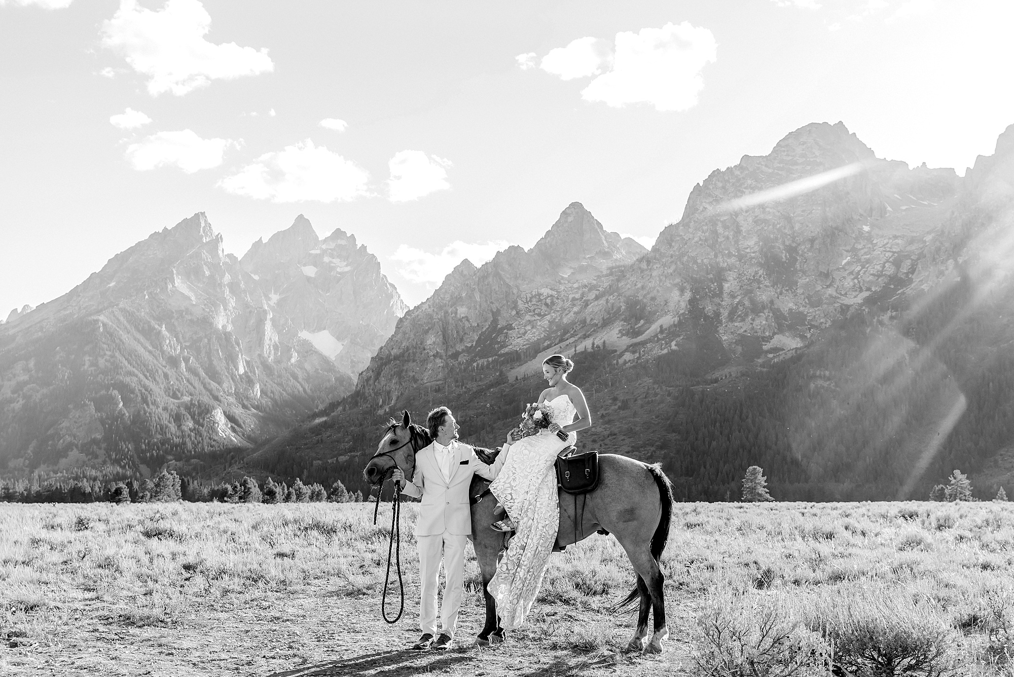 Cathedral View Turnout elopement ceremony Grand Teton National Park bride on horse Grand Teton elopement couple running down road Grand Teton elopement Jackson Hole micro wedding photographer how to get married in grand teton national park western wedding at Cathedral View Turnout horses in western wedding jackson hole