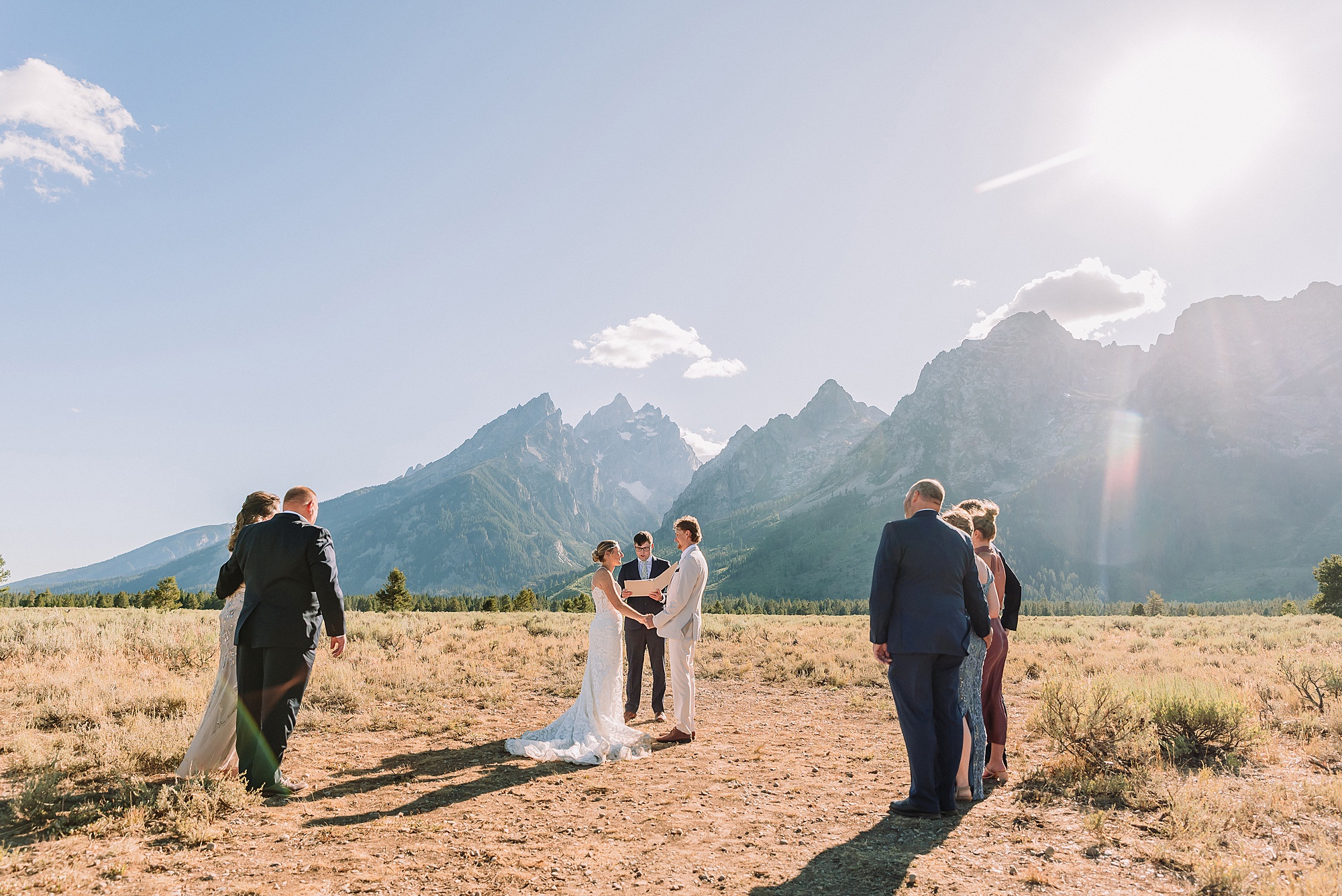 Cathedral View Turnout elopement ceremony Grand Teton National Park bride on horse Grand Teton elopement couple running down road Grand Teton elopement Jackson Hole micro wedding photographer how to get married in grand teton national park western wedding at Cathedral View Turnout horses in western wedding jackson hole
