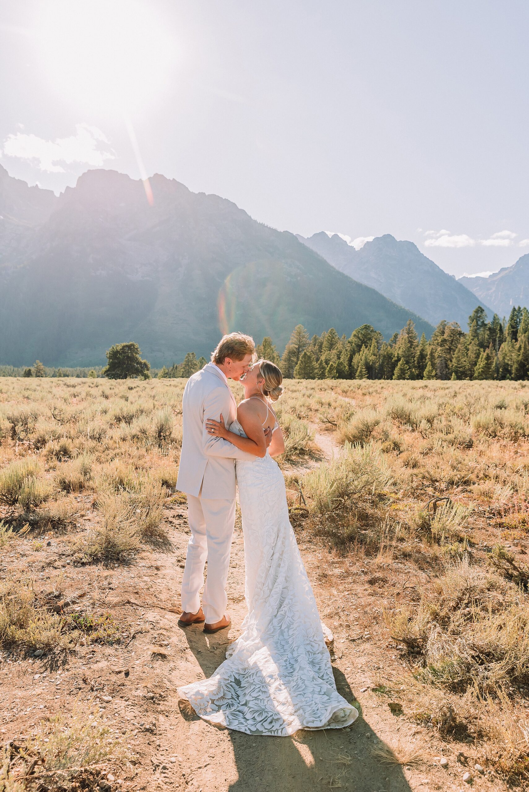 Cathedral View Turnout elopement ceremony Grand Teton National Park bride on horse Grand Teton elopement couple running down road Grand Teton elopement Jackson Hole micro wedding photographer how to get married in grand teton national park western wedding at Cathedral View Turnout horses in western wedding jackson hole