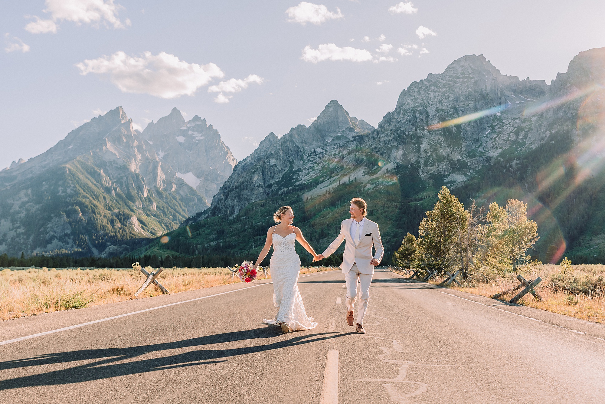 Grand Teton National Park Elopement Photographer Cathedral View Turnout elopement ceremony Grand Teton National Park bride on horse Grand Teton elopement couple running down road Grand Teton elopement Jackson Hole micro wedding photographer how to get married in grand teton national park western wedding at Cathedral View Turnout horses in western wedding jackson hole
