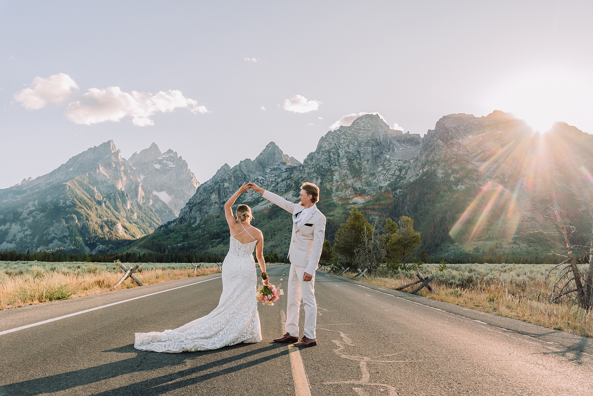 Cathedral View Turnout elopement ceremony Grand Teton National Park bride on horse Grand Teton elopement couple running down road Grand Teton elopement Jackson Hole micro wedding photographer how to get married in grand teton national park western wedding at Cathedral View Turnout horses in western wedding jackson hole