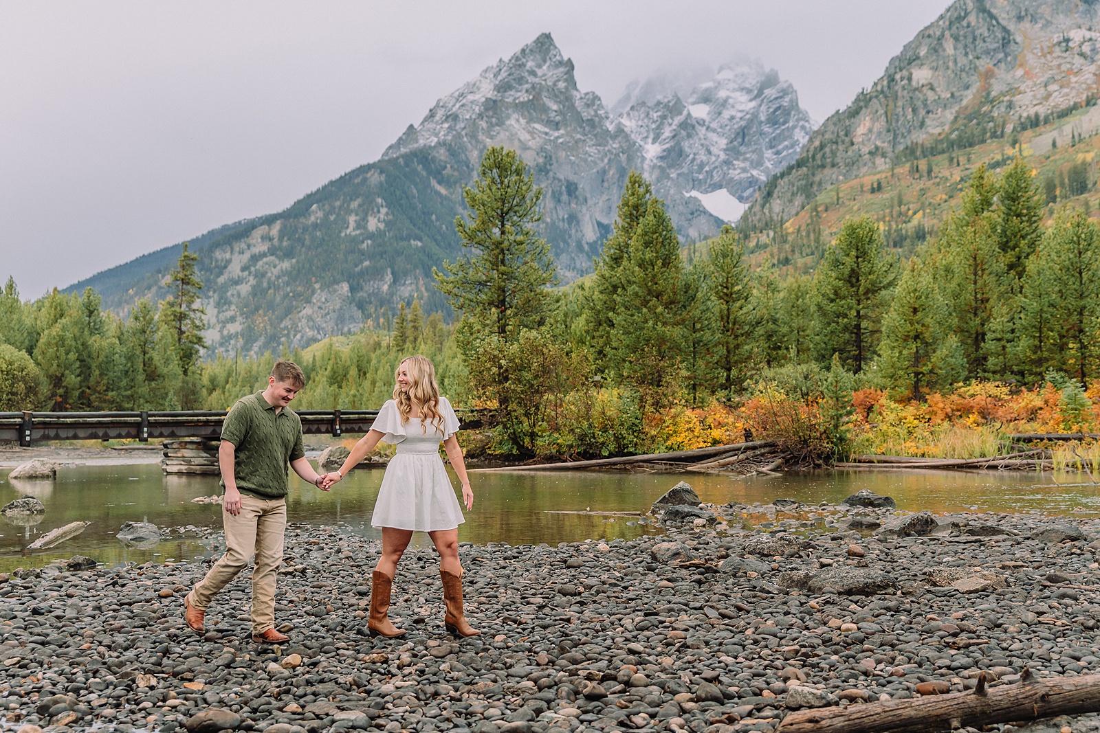 String Lake fall engagement photos Grand Teton National Park Rainy day engagement photos Grand Teton National Park fall Fall colors engagement session String Lake Wyoming mountains Couple getting engaged with Teton mountain peaks in background jackson hole engagement photographer