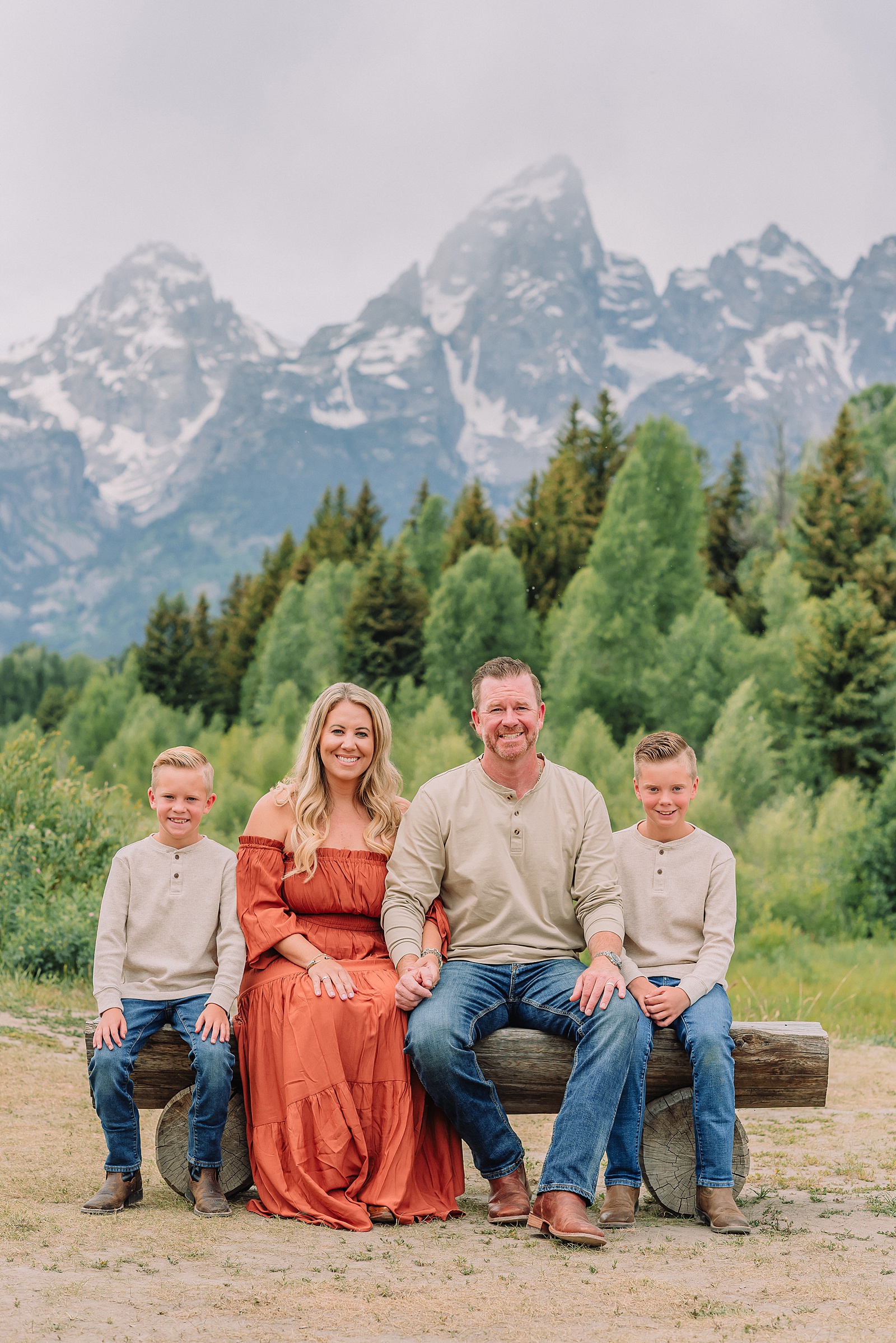family photos at Schwabacher Landing Grand Teton National Park summer family photography session in Jackson Hole Wyoming coordinated outfit ideas for family photos in the mountains rust dress family photos with mountain backdrop