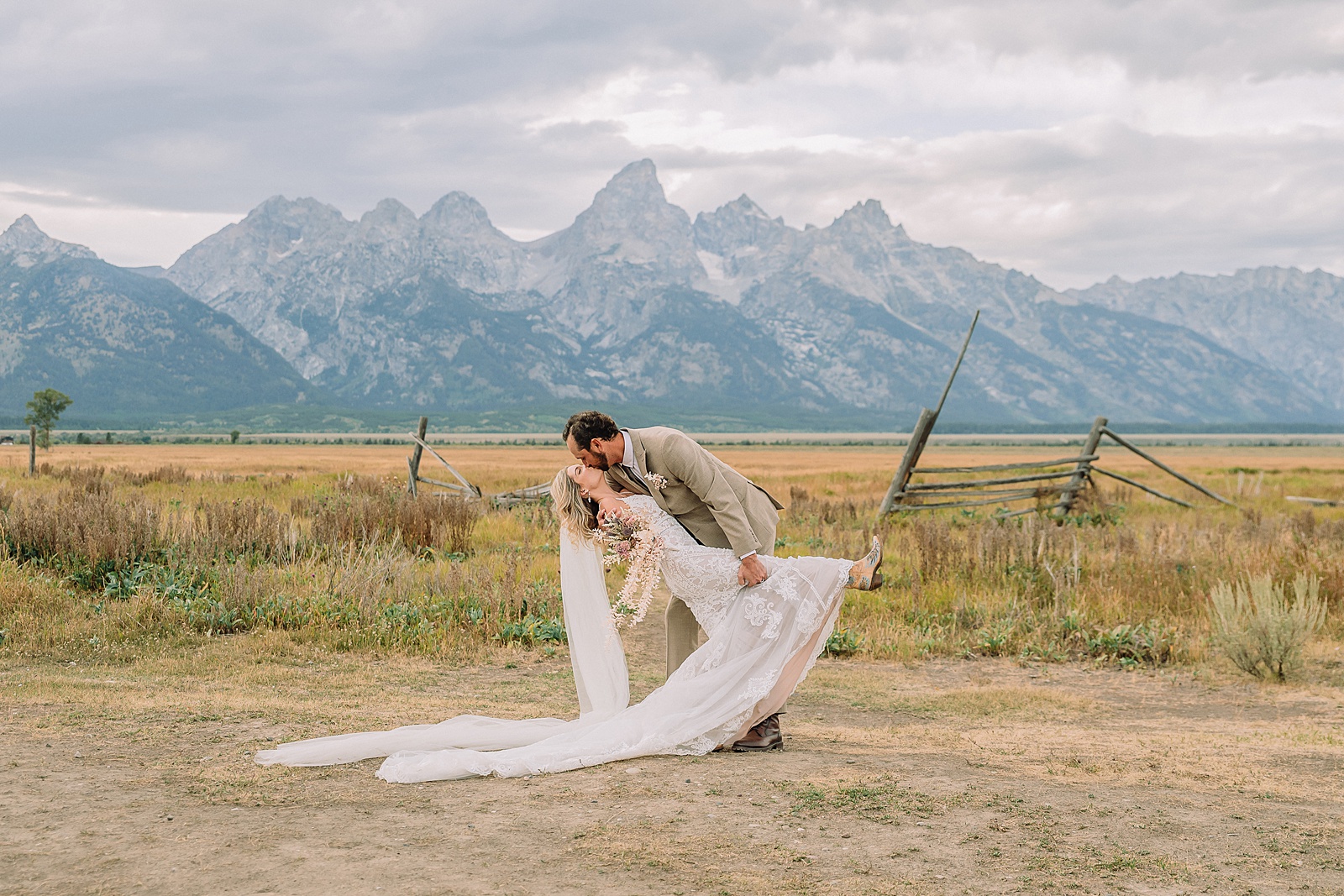 Mormon Row Grand Teton wedding ceremony cathedral veil alpine wedding photography fall colors Grand Teton elopement intimate outdoor micro wedding Wyoming champagne toast Grand Teton wedding celebration semi-formal outdoor alpine wedding attire first look Mormon Row Grand Tetons