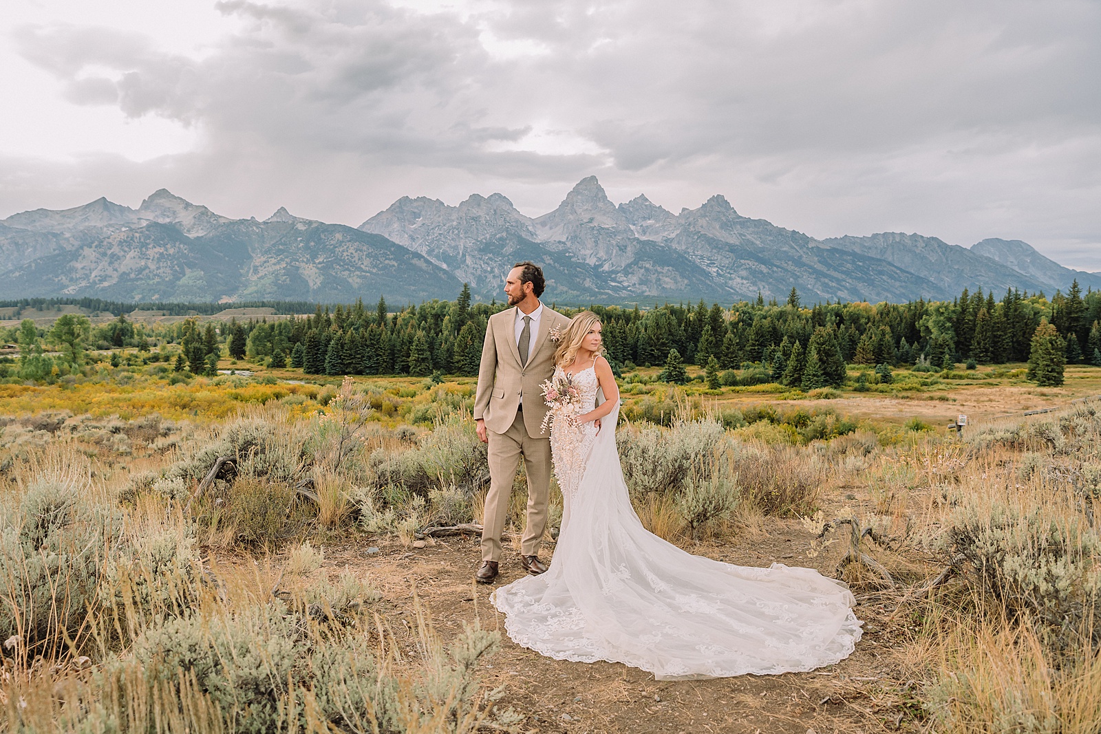 Jackson Hole micro wedding photographer Blacktail Ponds Overlook wedding portraits Wyoming Grand Teton wedding with moose wildlife September Grand Teton wedding fall colors dramatic cathedral veil sagebrush Teton backdrop
