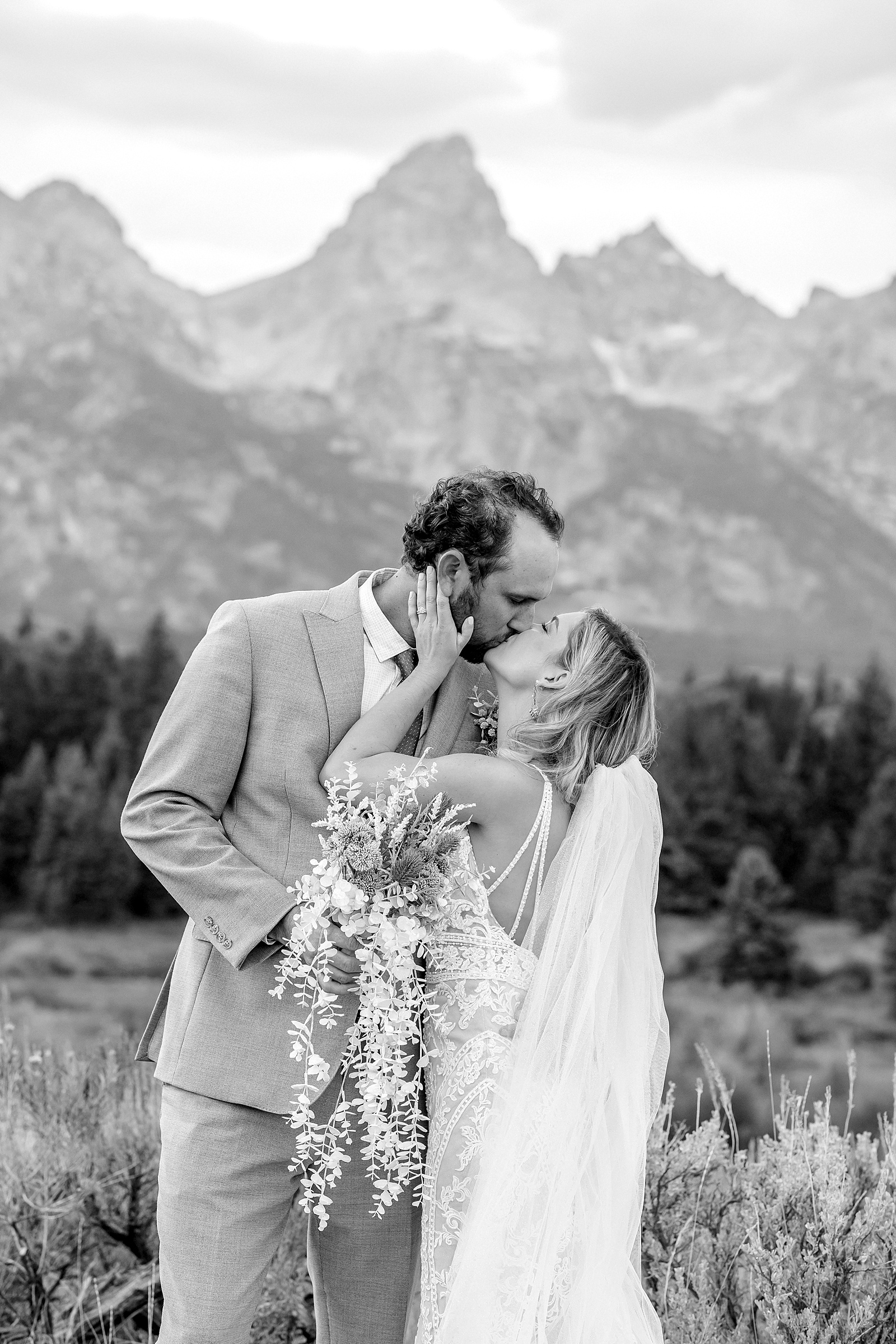 Jackson Hole micro wedding photographer Blacktail Ponds Overlook wedding portraits Wyoming Grand Teton wedding with moose wildlife September Grand Teton wedding fall colors dramatic cathedral veil sagebrush Teton backdrop