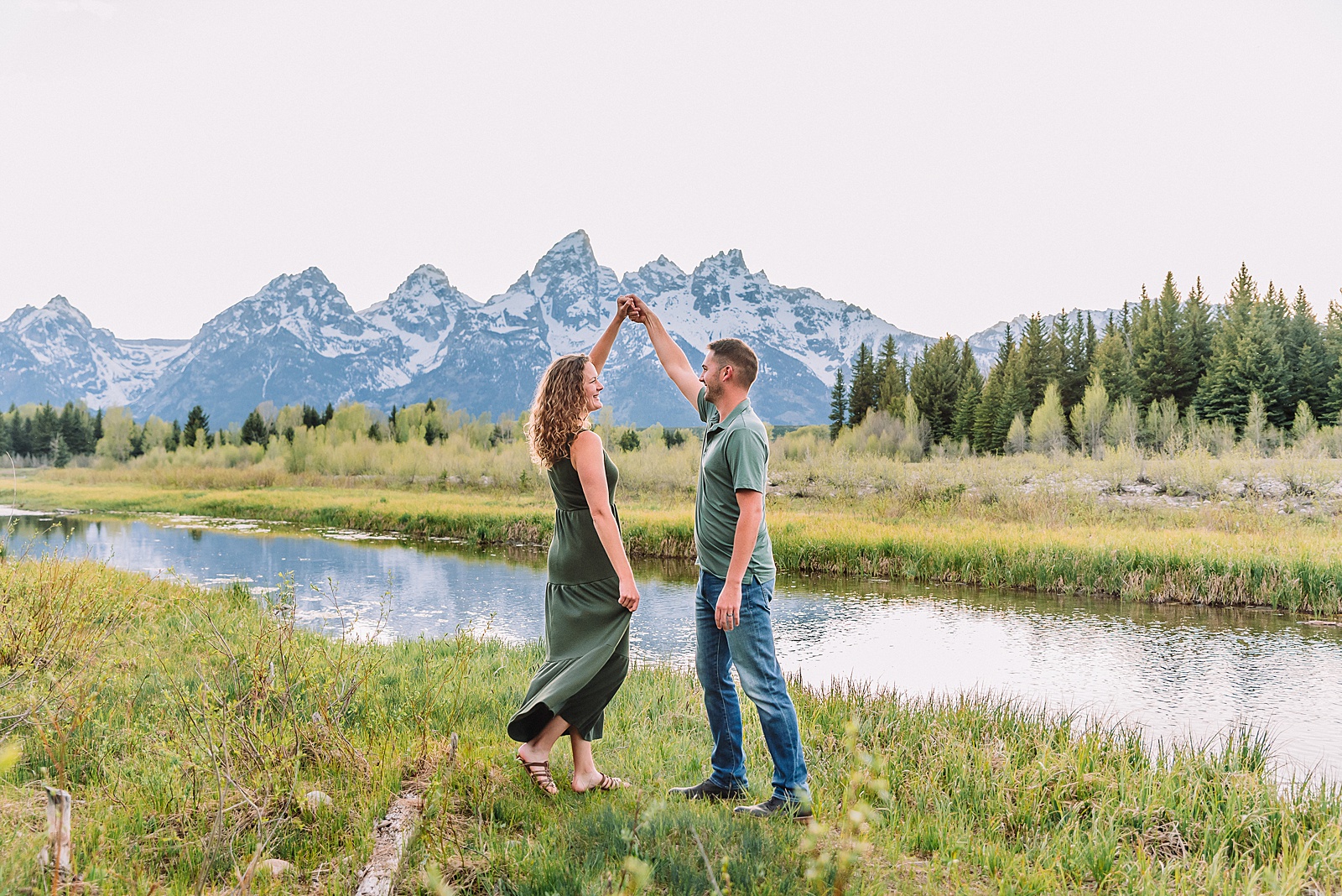 Schwabacher Landing sunset couples photography session green dress couples photos Schwabacher Landing reflections Teton mountain backdrop engagement photos Wyoming Jackson Hole Photographer Jackson Hole Couples Photography