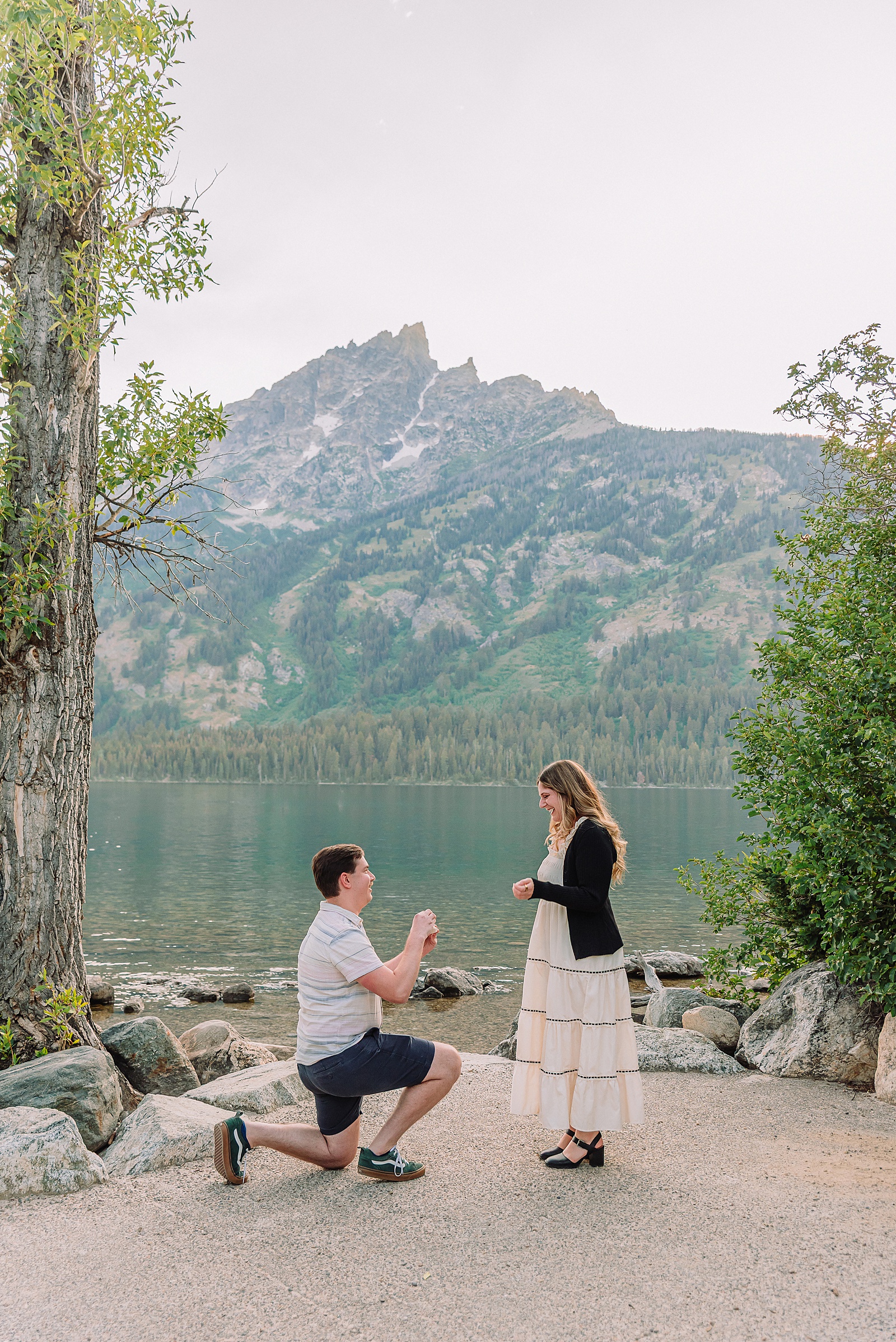 Jackson Hole Engagement Photographer grand teton national park proposal photography lakeside engagement portraits Jackson Hole surprise proposal photographer Grand Tetons Jenny Lake couple photos summer romantic Jackson Hole engagement session