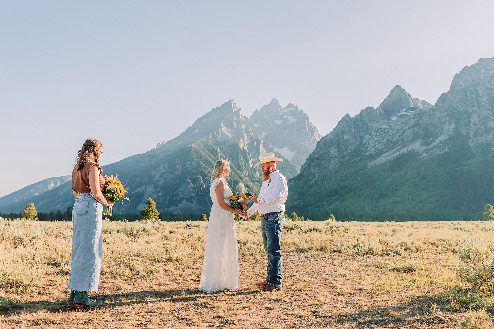 Jackson Hole vow renewal at Cathedral View Turnout intimate mountain vow renewal ceremony Wyoming 10 year anniversary vow renewal Grand Tetons beaded wedding dress mountain vow renewal Cathedral View Turnout vow renewal photographer Grand Teton National Park intimate wedding ceremony