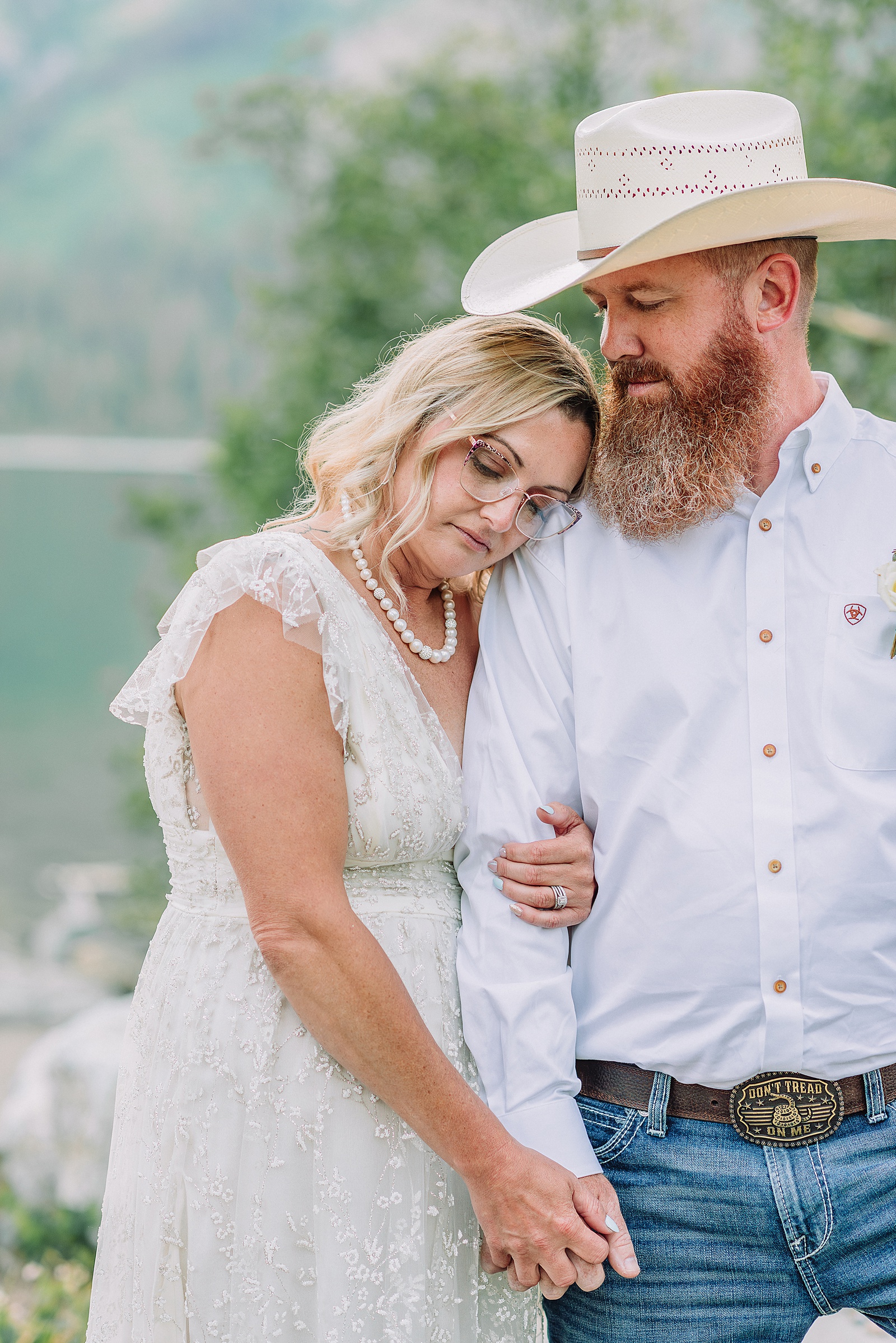 Jenny Lake vow renewal photography session romantic couples photos Jenny Lake Jackson Hole couple dancing in water Jenny Lake Wyoming mountain elopement with Teton backdrop Jackson Hole Photographer romantic Jackson Hole couple photography