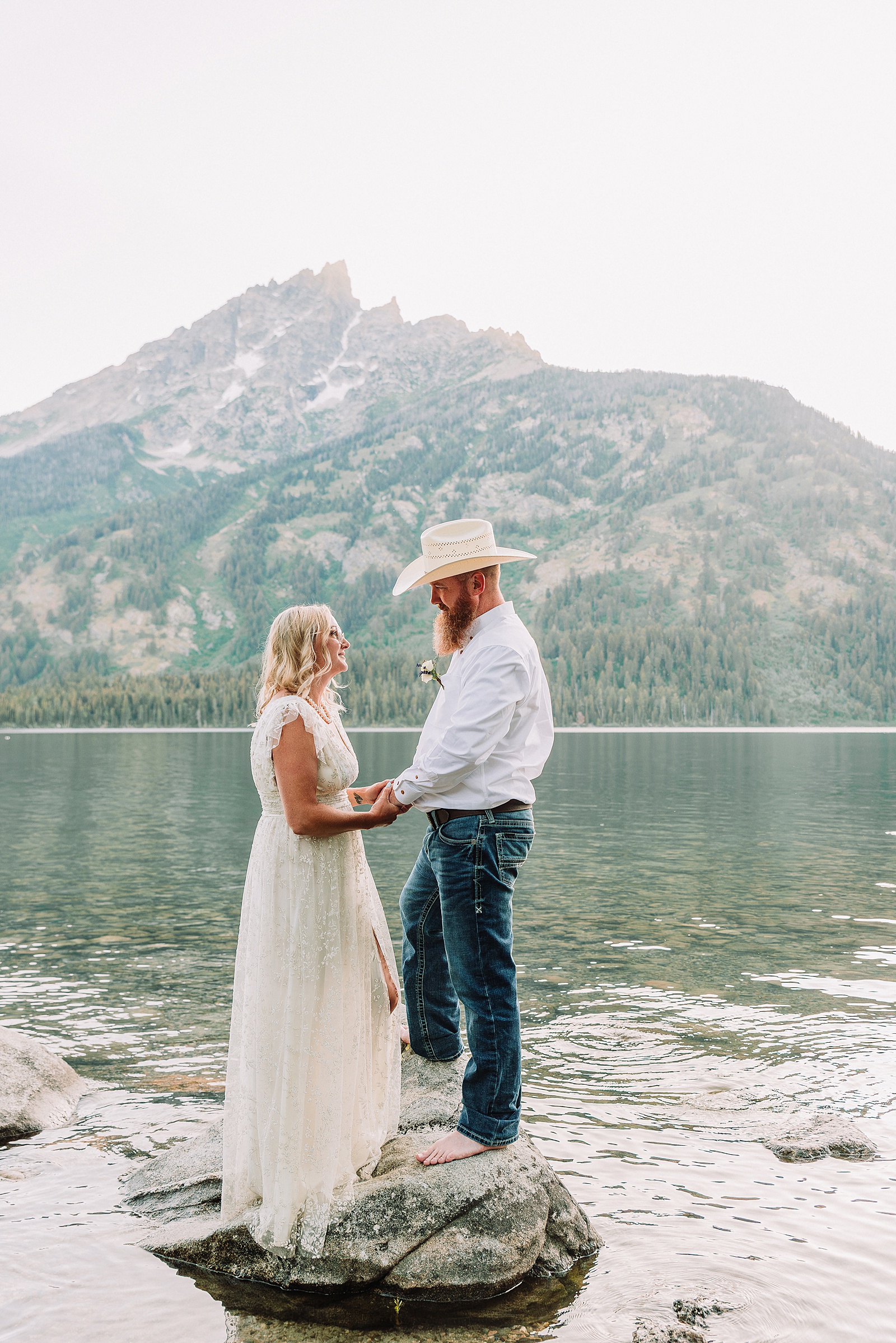 Jenny Lake vow renewal photography session romantic couples photos Jenny Lake Jackson Hole couple dancing in water Jenny Lake Wyoming mountain elopement with Teton backdrop Jackson Hole Photographer romantic Jackson Hole couple photography