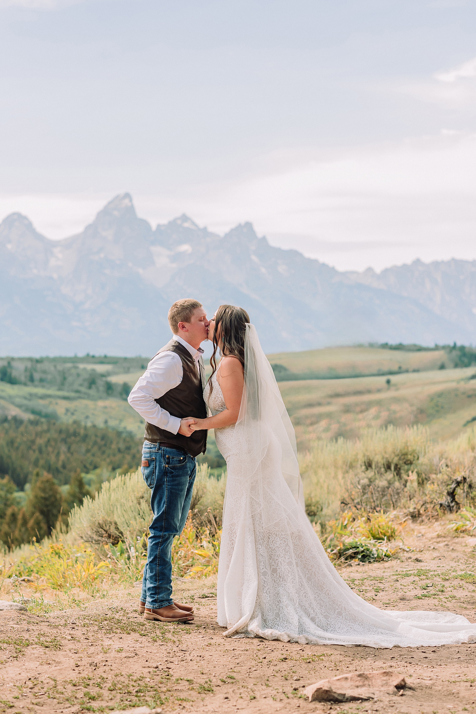 Bridger Teton National Forest outdoor wedding ceremony custom cowboy hat wedding surprise groom gift The Wedding Tree ceremony photos Wyoming champagne toast Grand Teton wedding celebration Jackson Hole Wedding Photographer