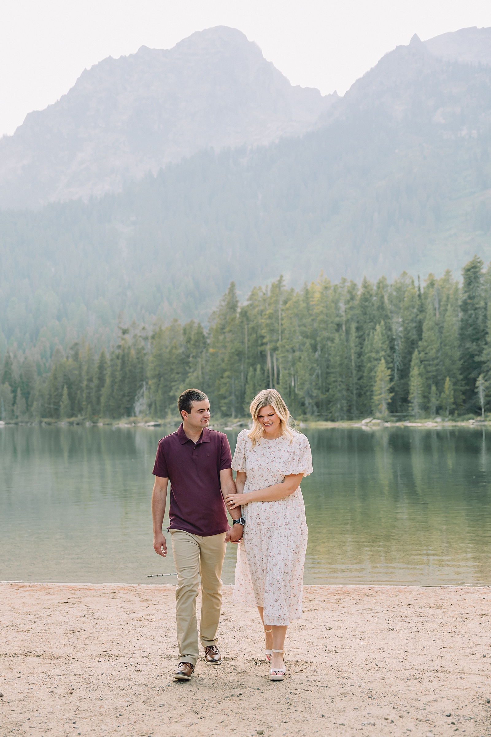 String Lake engagement photos in Grand Teton National Park Jackson Hole mountain engagement photography Teton engagement session at String Lake cream floral dress engagement photos Jackson Wyoming LDS temple wedding engagement photos Tetons fall engagement photo outfits Jackson Hole String Lake Wyoming couple photography session