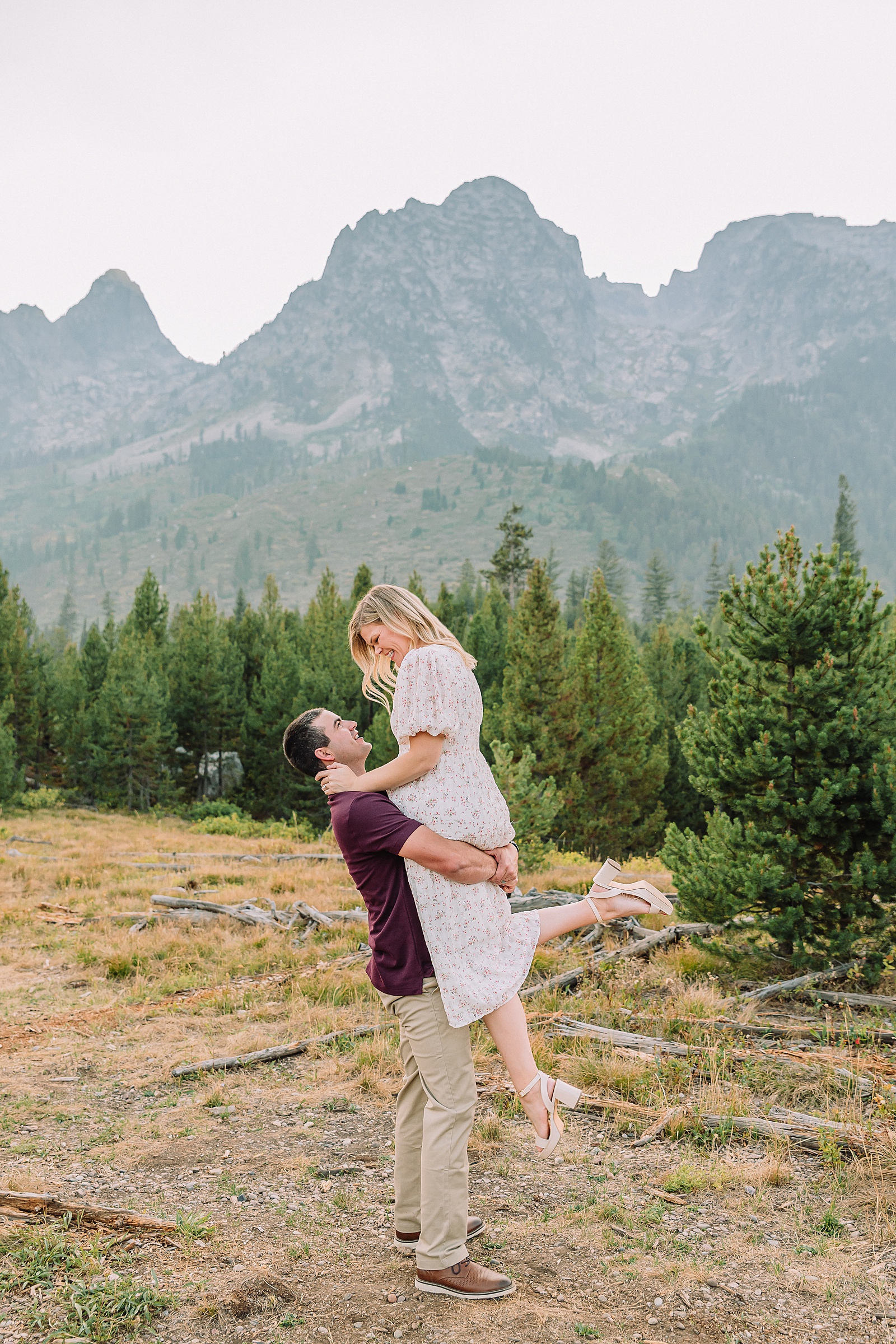 String Lake engagement photos in Grand Teton National Park Jackson Hole mountain engagement photography Teton engagement session at String Lake cream floral dress engagement photos Jackson Wyoming LDS temple wedding engagement photos Tetons fall engagement photo outfits Jackson Hole String Lake Wyoming couple photography session