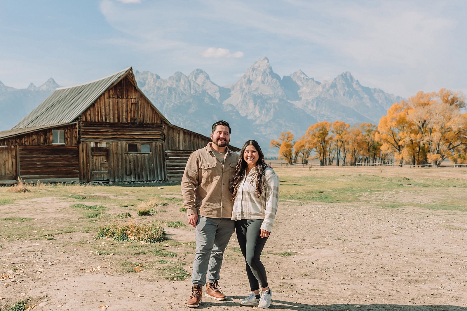 Grand Teton National Park proposal photographer Mormon Row barn proposal photos October proposal session in Jackson Hole surprise proposal at Mormon Row Tetons