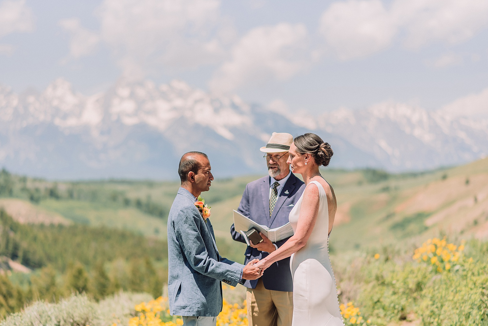 intimate Jackson Hole wedding photography The Wedding Tree ceremony photos Wyoming Wyoming mountain elopement at Wedding Tree June wildflower wedding ceremony Grand Tetons Wedding Tree elopement photographer Grand Teton National Park wildflower bouquet mountain wedding photography