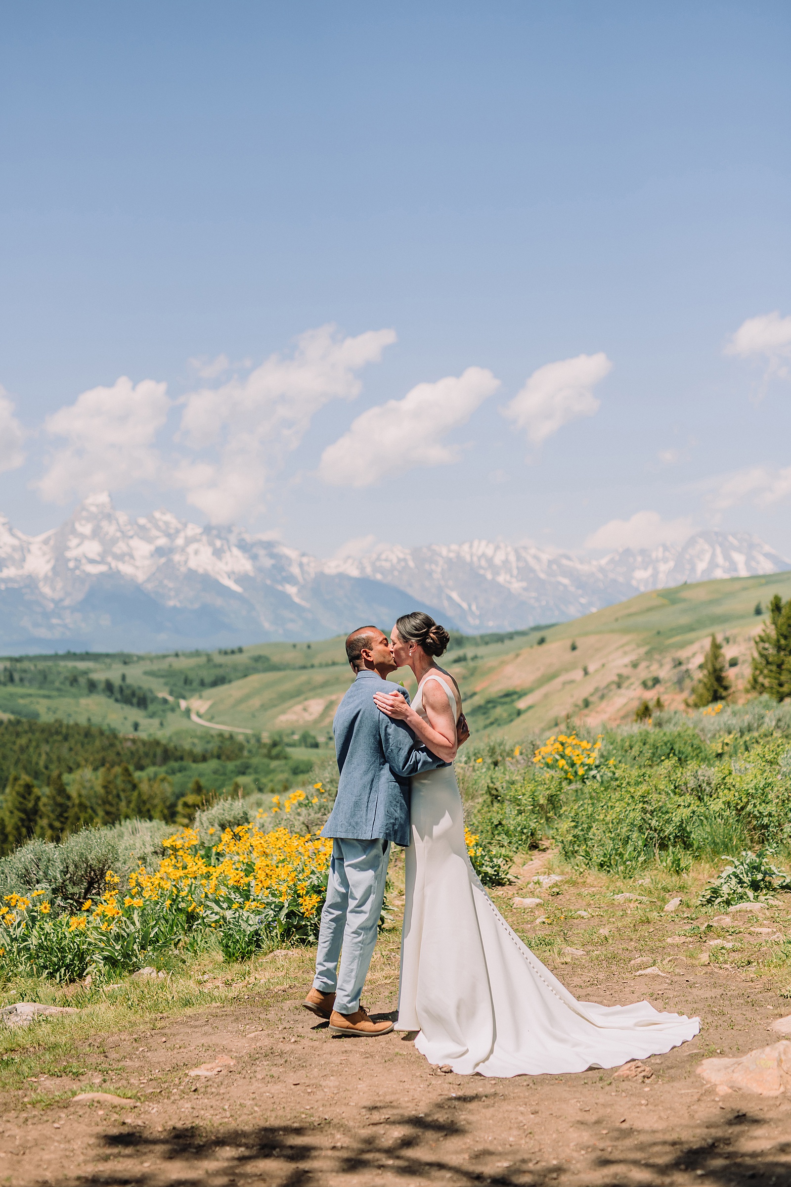 intimate Jackson Hole wedding photography The Wedding Tree ceremony photos Wyoming Wyoming mountain elopement at Wedding Tree June wildflower wedding ceremony Grand Tetons Wedding Tree elopement photographer Grand Teton National Park wildflower bouquet mountain wedding photography