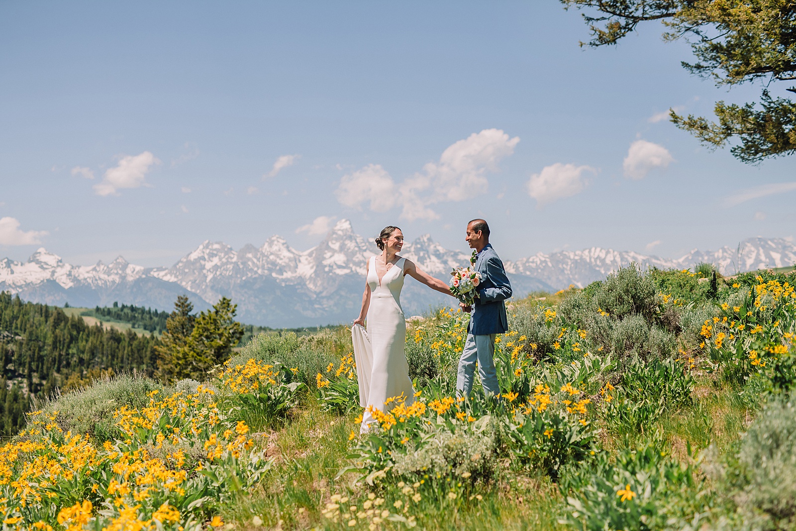 intimate Jackson Hole wedding photography The Wedding Tree ceremony photos Wyoming Wyoming mountain elopement at Wedding Tree June wildflower wedding ceremony Grand Tetons Wedding Tree elopement photographer Grand Teton National Park wildflower bouquet mountain wedding photography