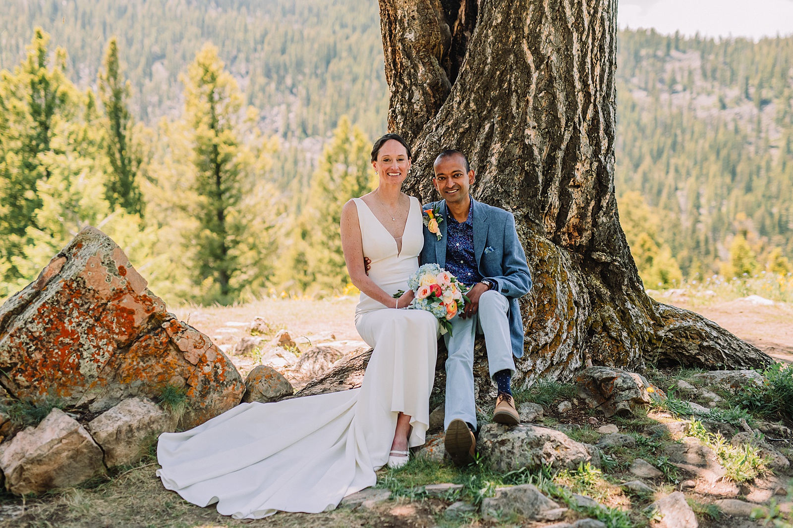 intimate Jackson Hole wedding photography The Wedding Tree ceremony photos Wyoming Wyoming mountain elopement at Wedding Tree June wildflower wedding ceremony Grand Tetons Wedding Tree elopement photographer Grand Teton National Park wildflower bouquet mountain wedding photography