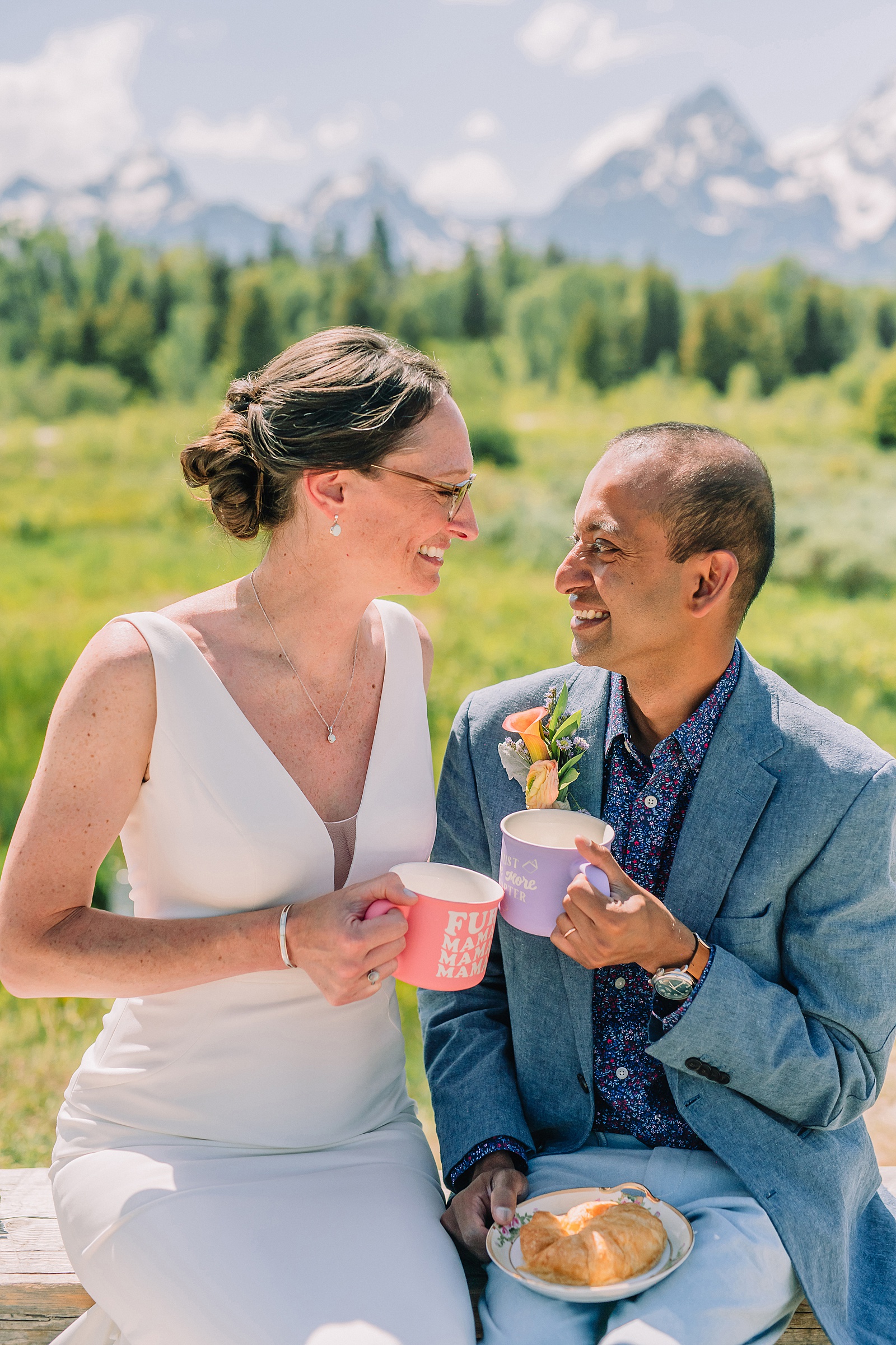 intimate elopement photography Schwabacher Landing champagne toast at Wyoming elopement personalized coffee mug elopement surprise mountain wedding with snow capped Teton peaks Jackson Hole destination wedding photographer Grand Teton elopement photography session