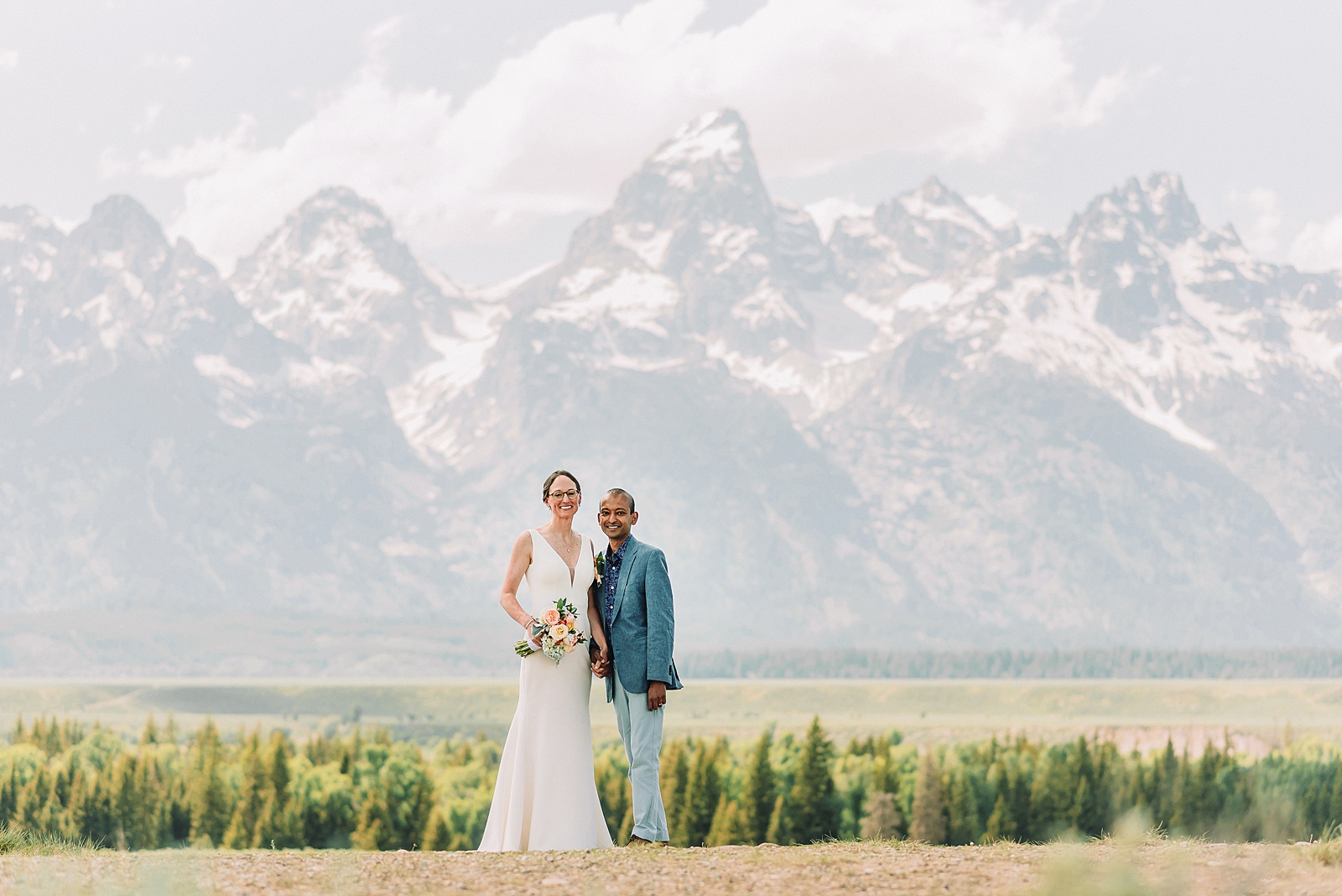 intimate elopement photography Schwabacher Landing champagne toast at Wyoming elopement personalized coffee mug elopement surprise mountain wedding with snow capped Teton peaks Jackson Hole destination wedding photographer Grand Teton elopement photography session