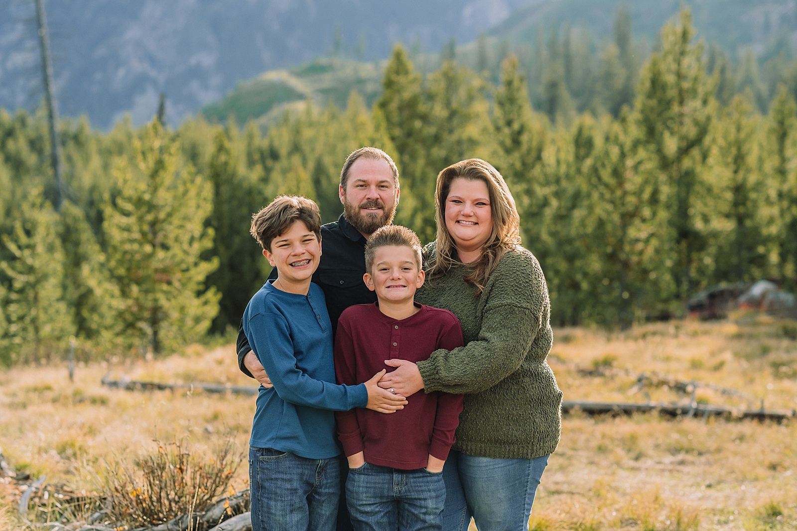 extended family photos in Jackson Hole Wyoming String Lake family photography session Jackson Hole multi generational family portraits in the mountains Grand Teton National Park family photographer windy mountain family session Jackson Hole Arizona family visiting Jackson Hole photos three generation family photos at String Lake Jackson Hole extended family photographer