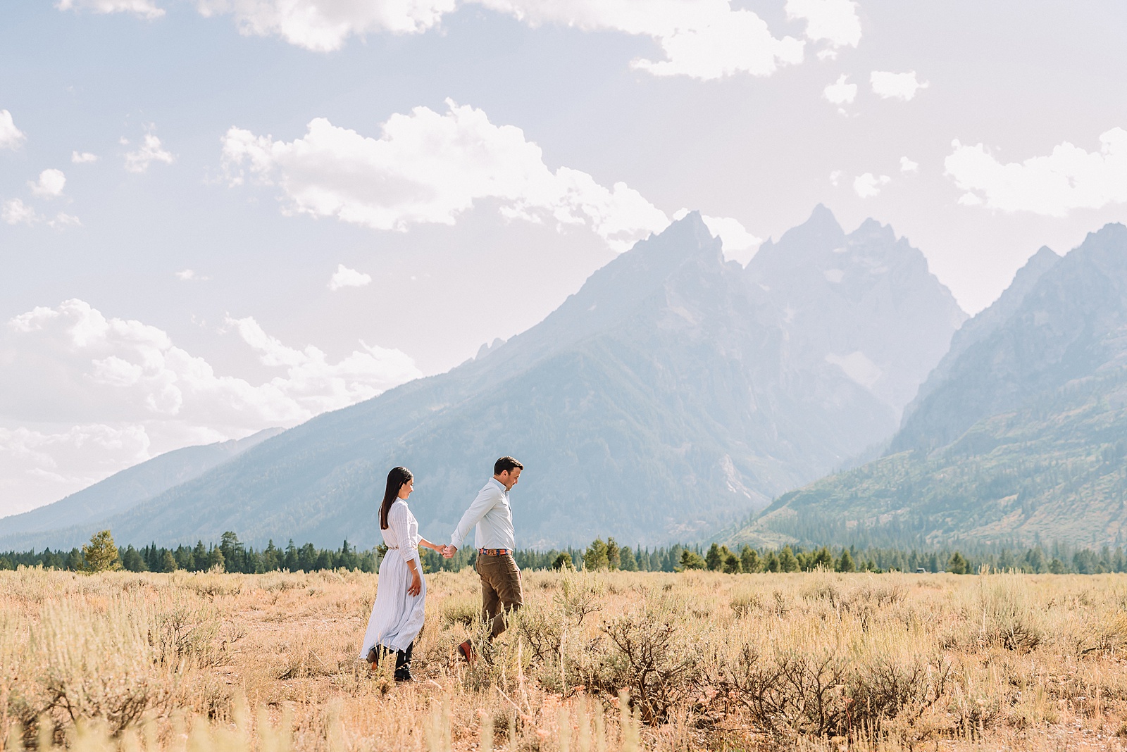 Engagements in the Tetons cathedral view turnout engagement session grand teton national park proposal photography august proposal grand teton wyoming intimate mountain proposal photography