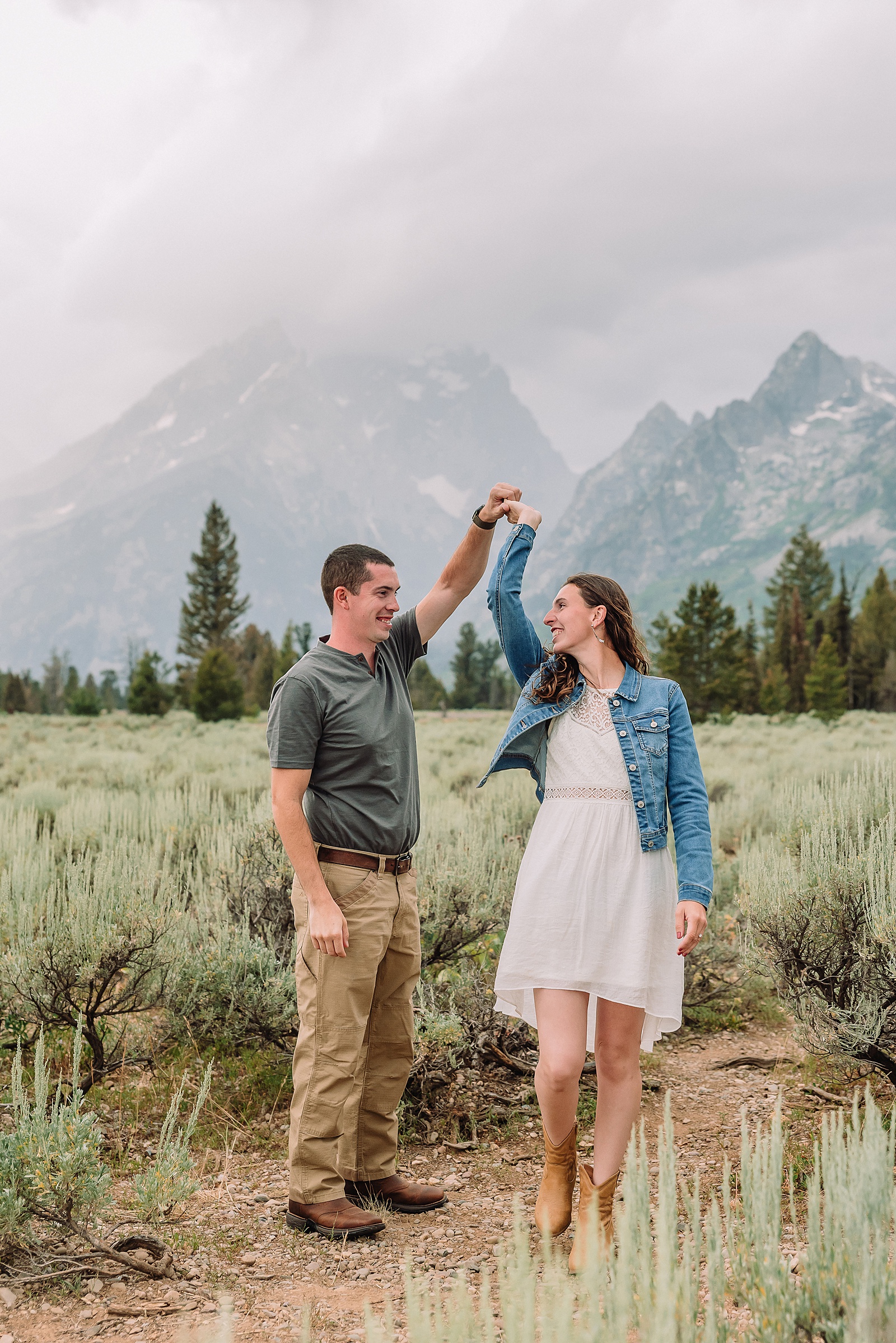 outdoor family photos with baby Grand Tetons purple western shirt family portraits Wyoming cream plaid toddler outdoor photos mountains flexible outdoor photography session inclement weather Jackson Hole Photographer Grand Teton National Park family photographer