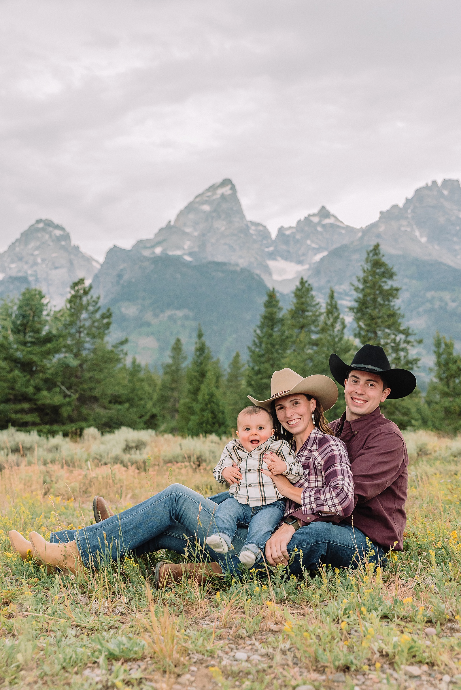 outdoor family photos with baby Grand Tetons purple western shirt family portraits Wyoming cream plaid toddler outdoor photos mountains flexible outdoor photography session inclement weather Jackson Hole Photographer Grand Teton National Park family photographer